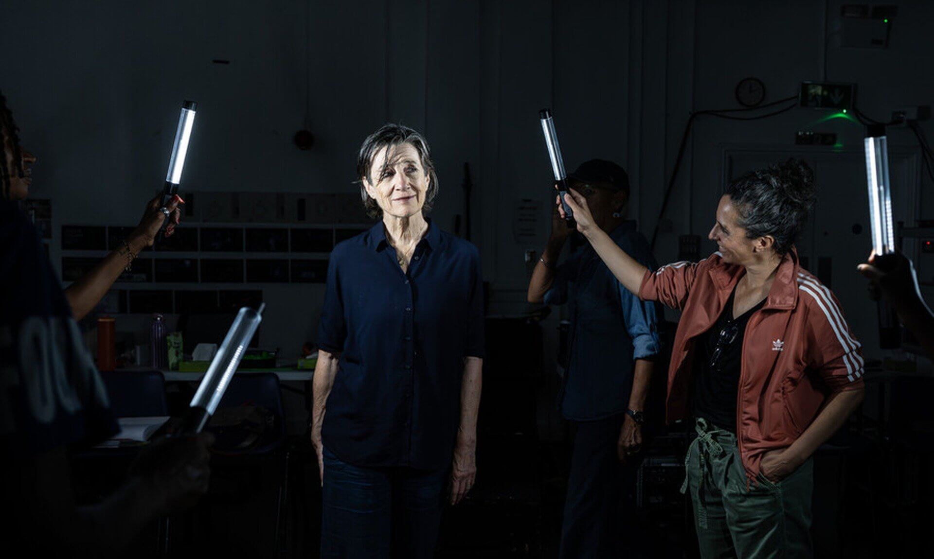 RSC Julius Caesar rehearsal with actors holding light tubes