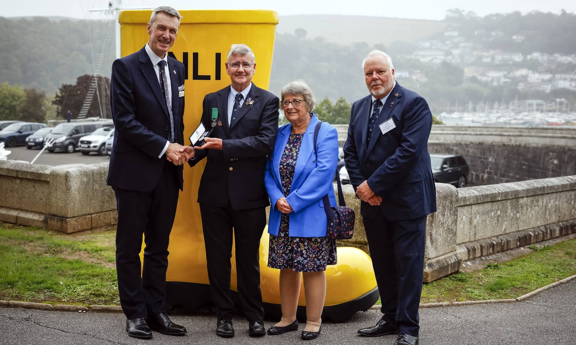Eric Taylor receiving his RNLI Long Service Medal at Dartmouth