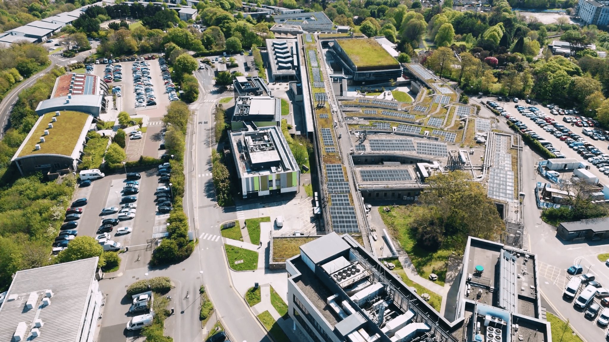 Aerial view of Penryn Campus showing rooftop solar panels and green roofs