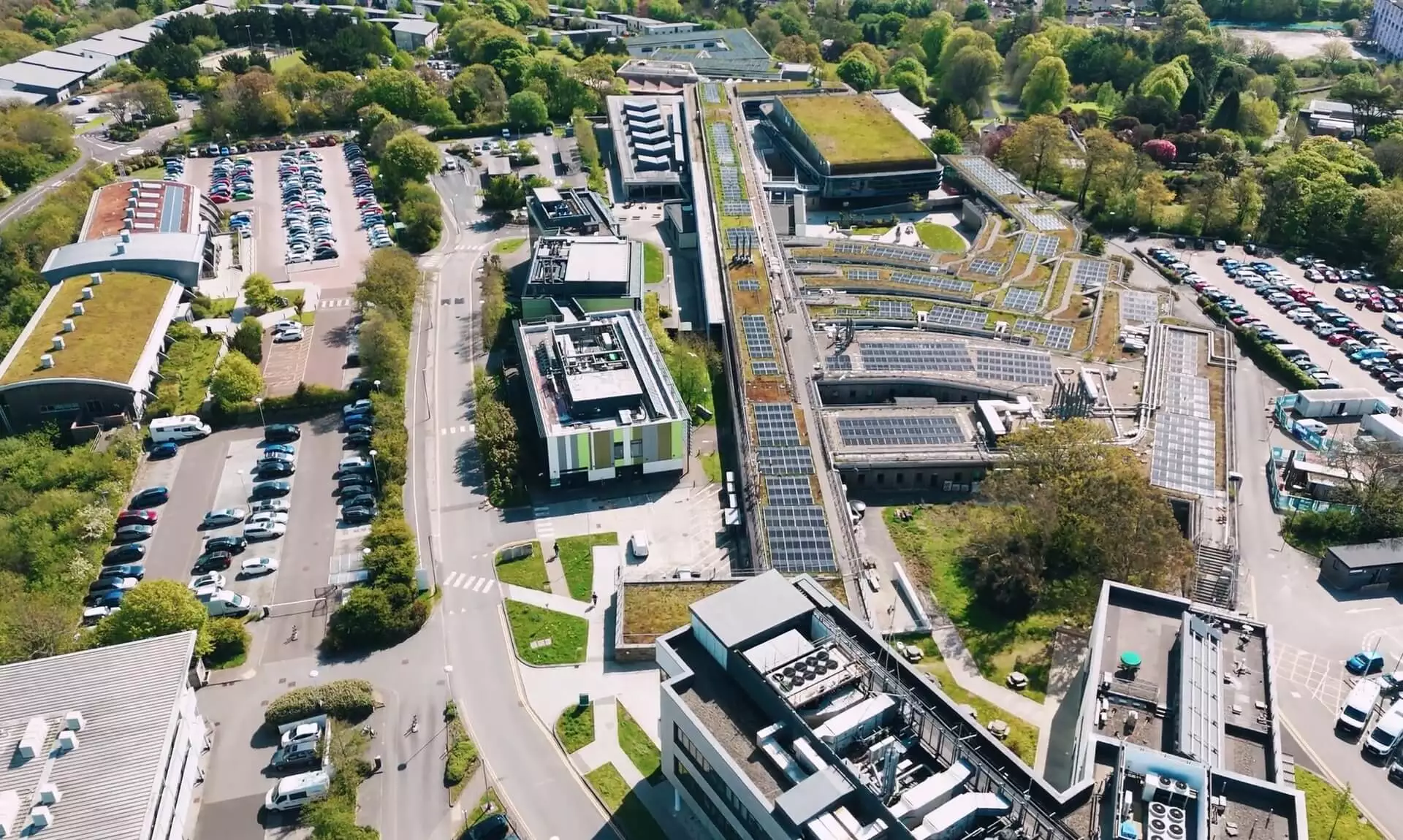 Aerial view of Penryn Campus showing rooftop solar panels and green roofs