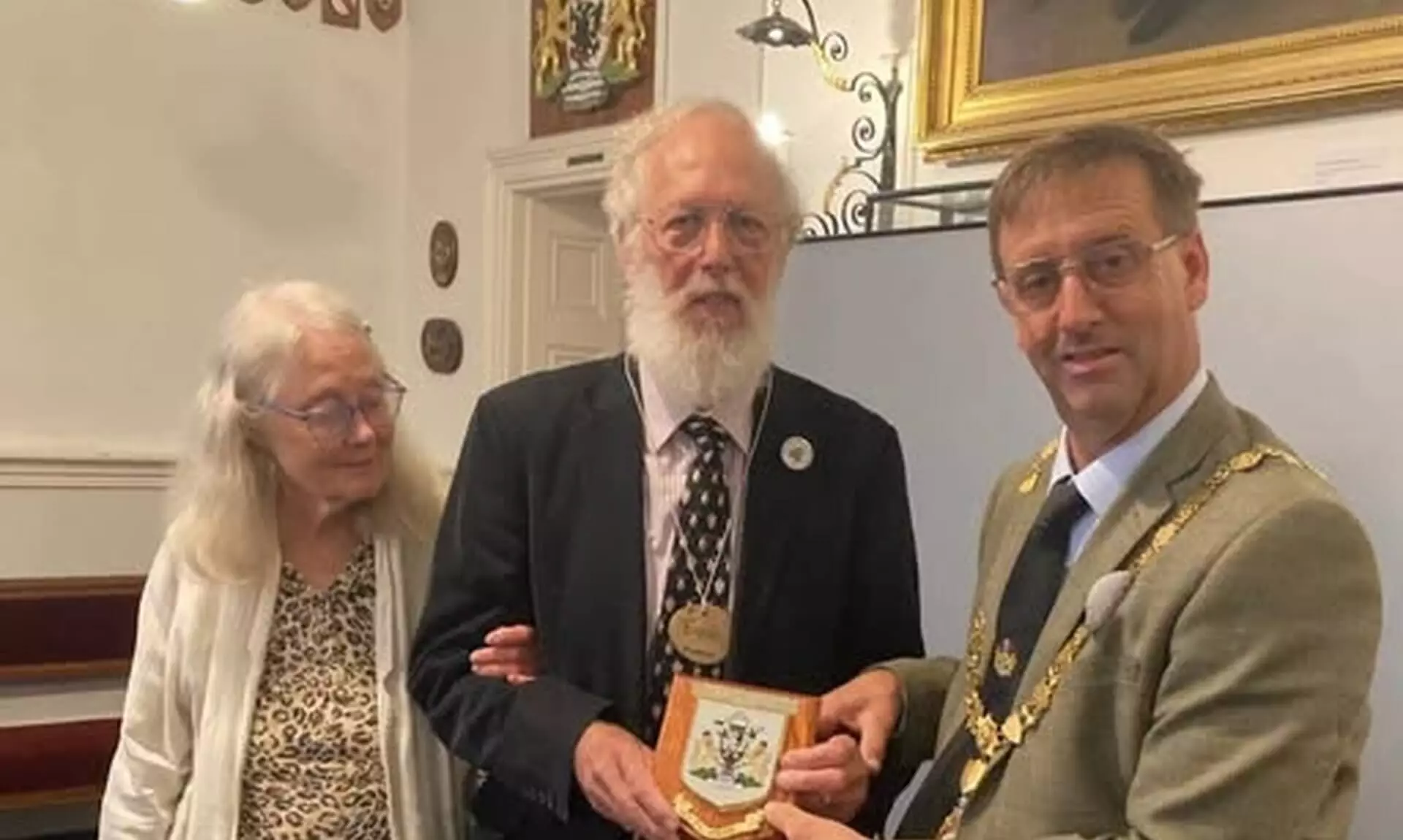 Mayor of Falmouth Cllr Alan Jewell presents Euan McPhee with a Falmouth Town Council plaque