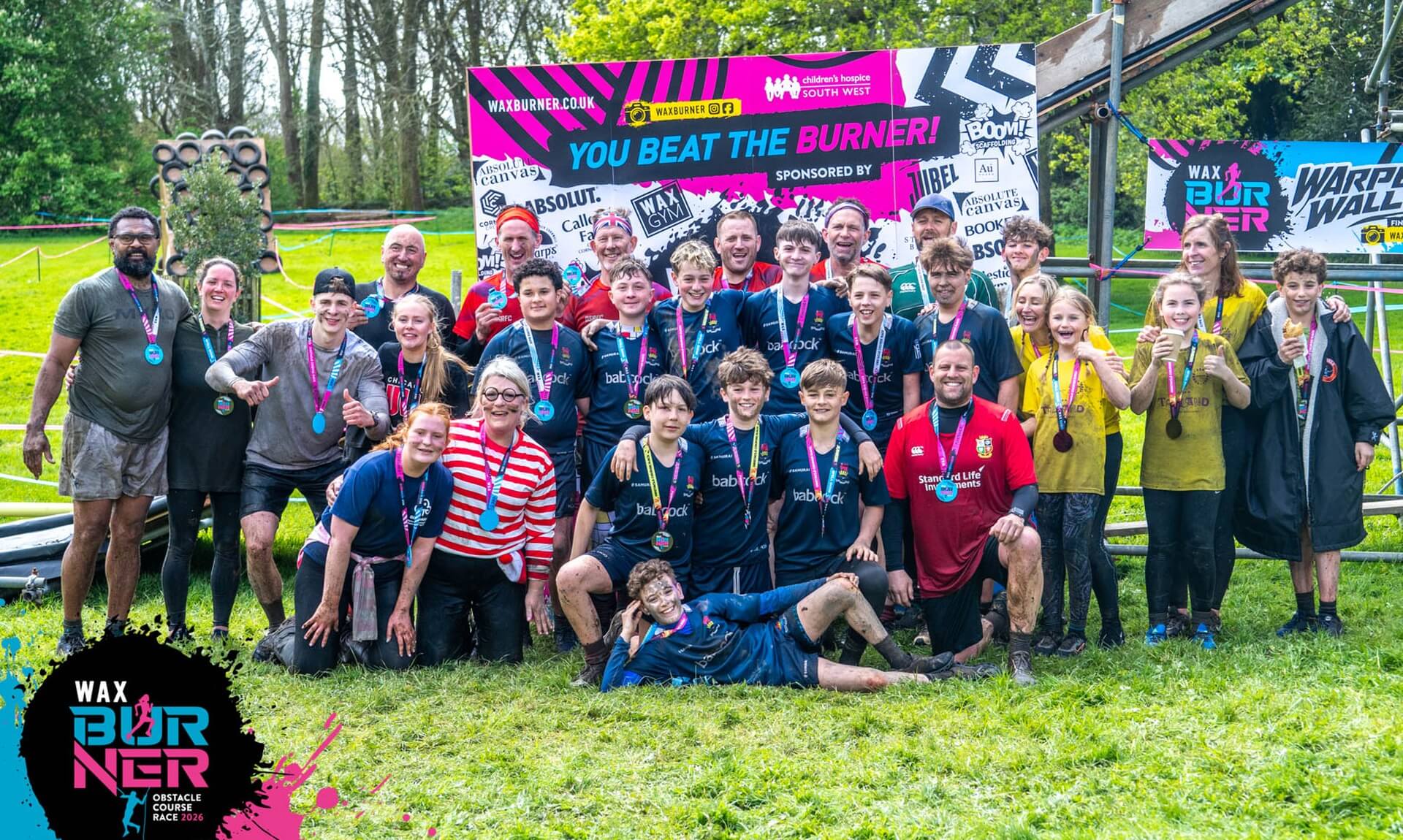 Group of WAX Burner finishers with medals at Trewan Hall near Newquay
