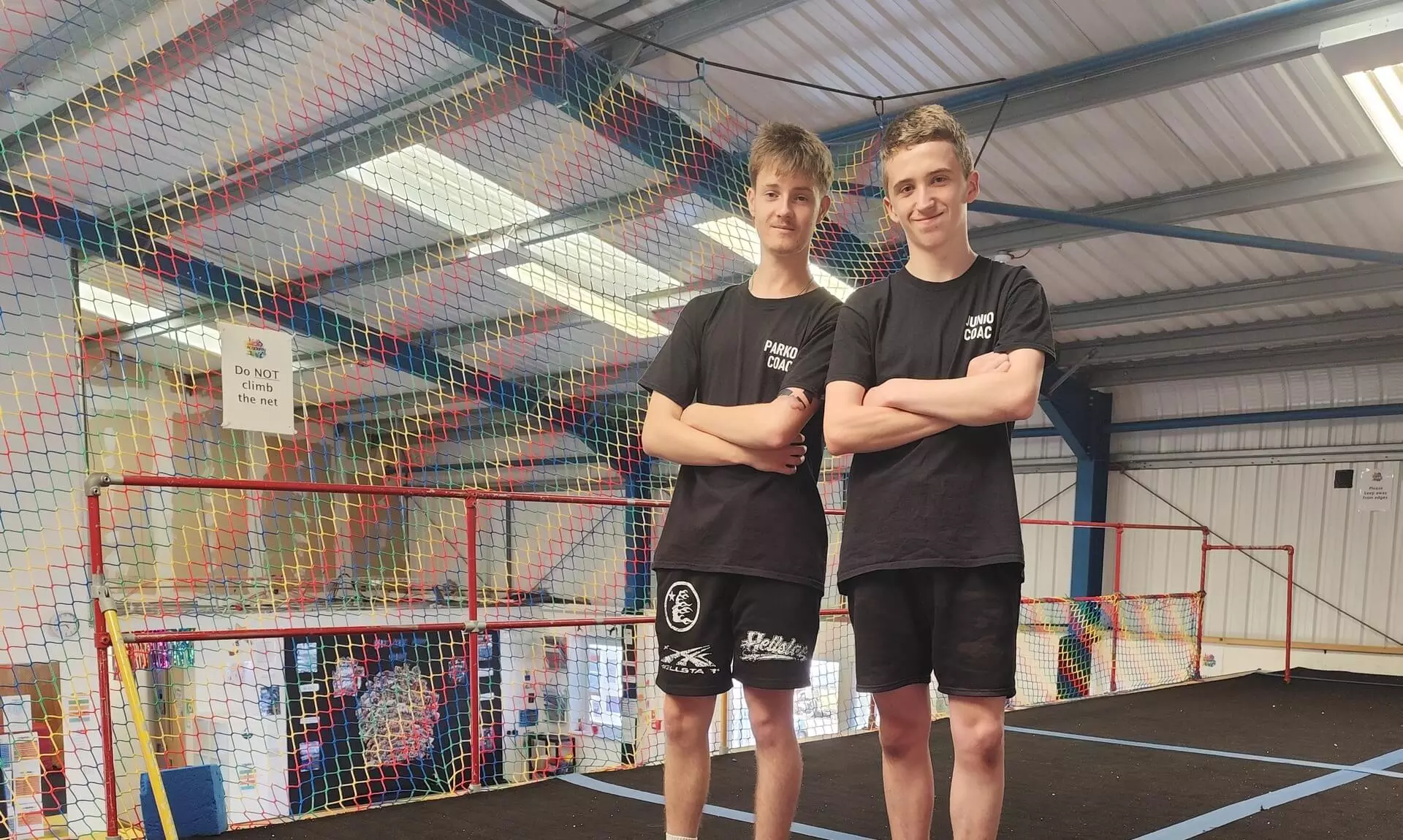 Two coaches standing in the parkour studio at West Coast Academy