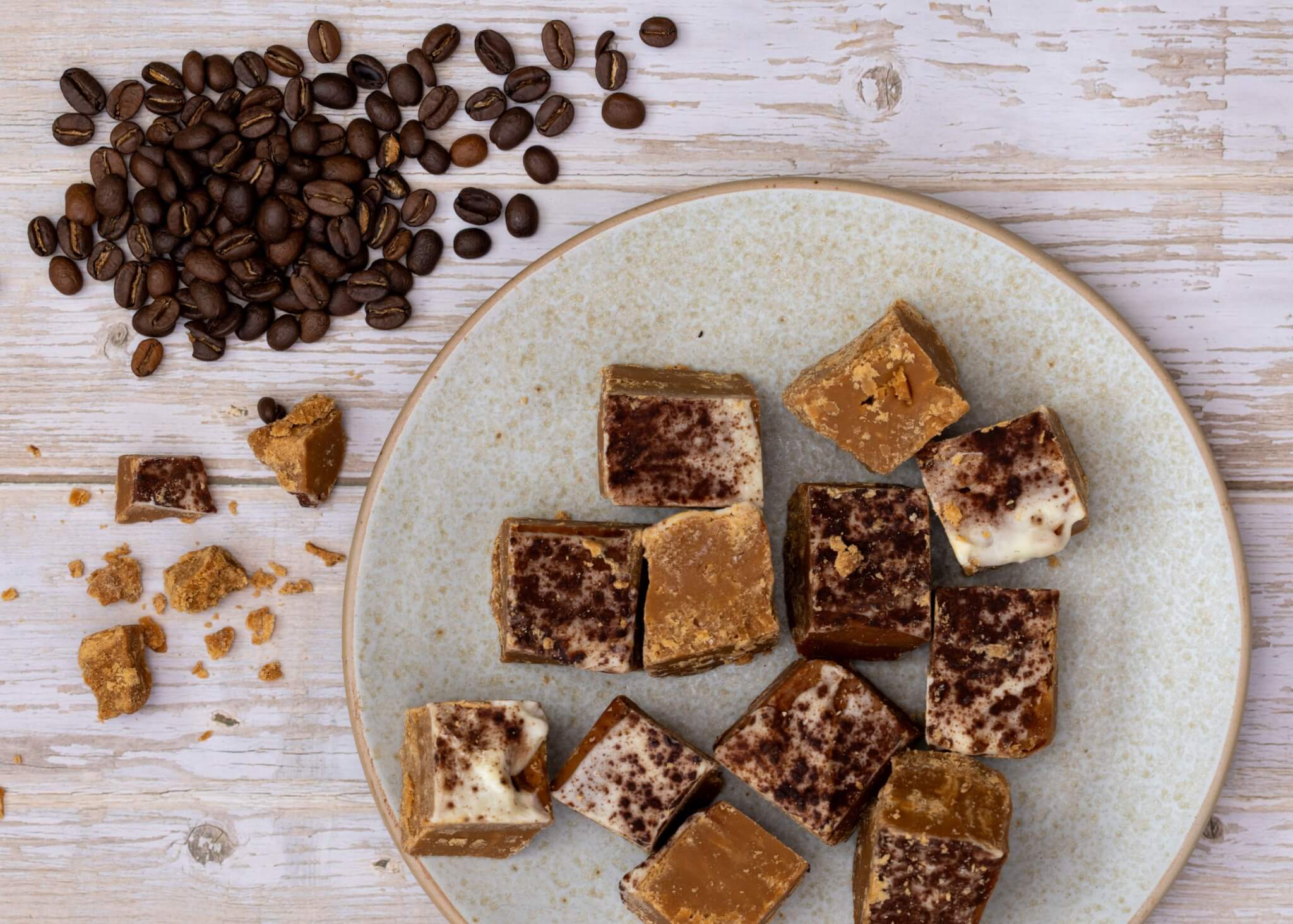 Tiramisu Fudge on a plate with coffee beans