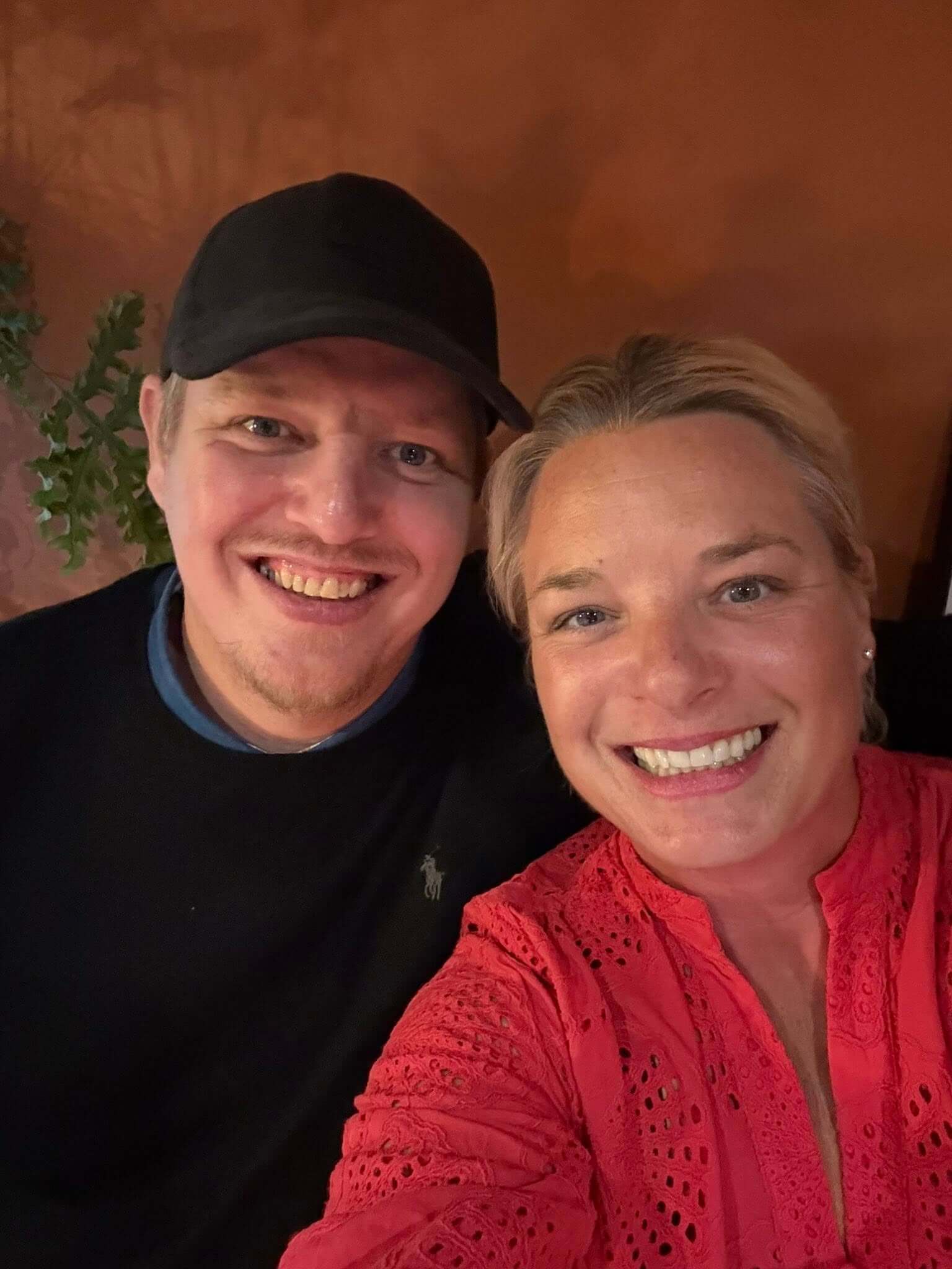 Two people smiling in a selfie