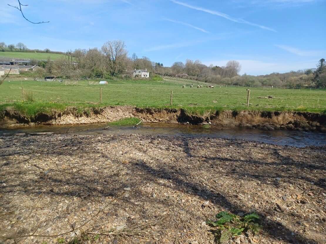 Eroded bank along a field edge on the Lower River Ruthern before the work
