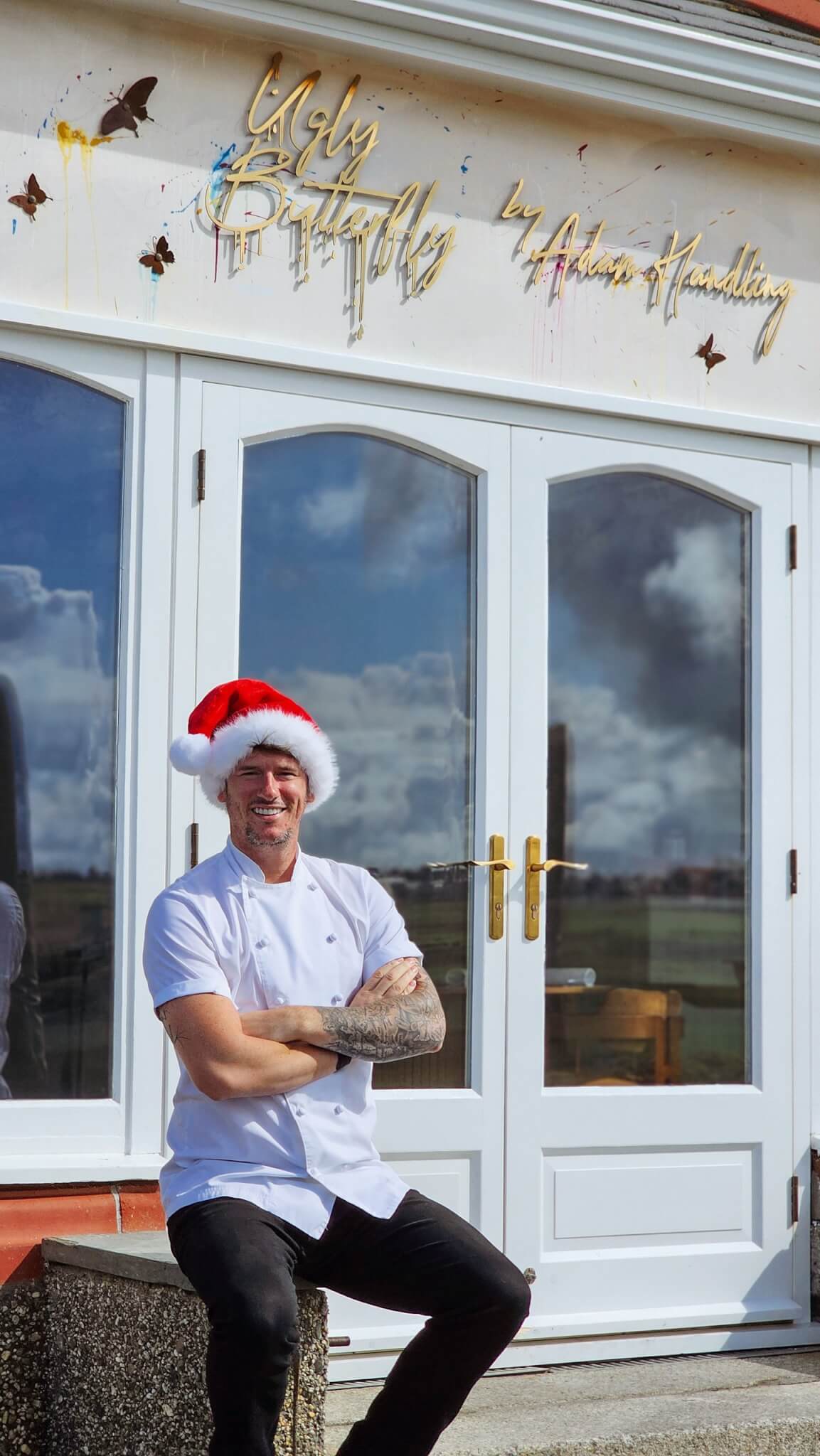 Chef Adam Handling in a Santa hat outside Ugly Butterfly in Newquay