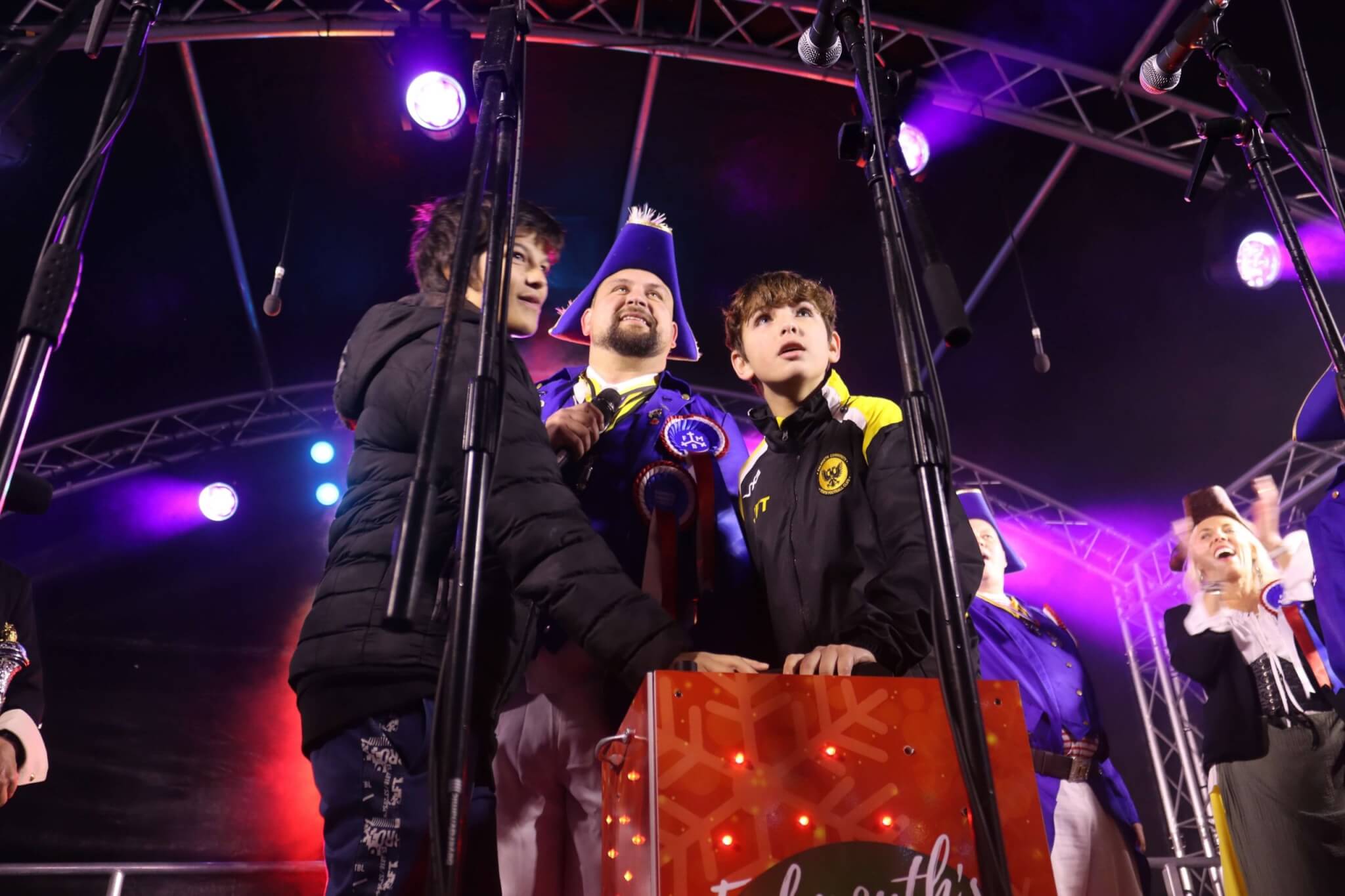 Last year's Falmouth Christmas lights switch-on nominee on stage at the button