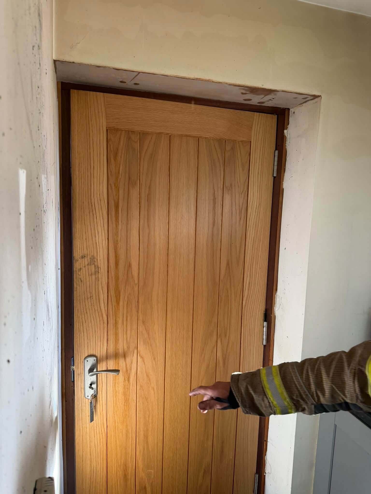 Kitchen side of the same fire door, with the oak barely marked