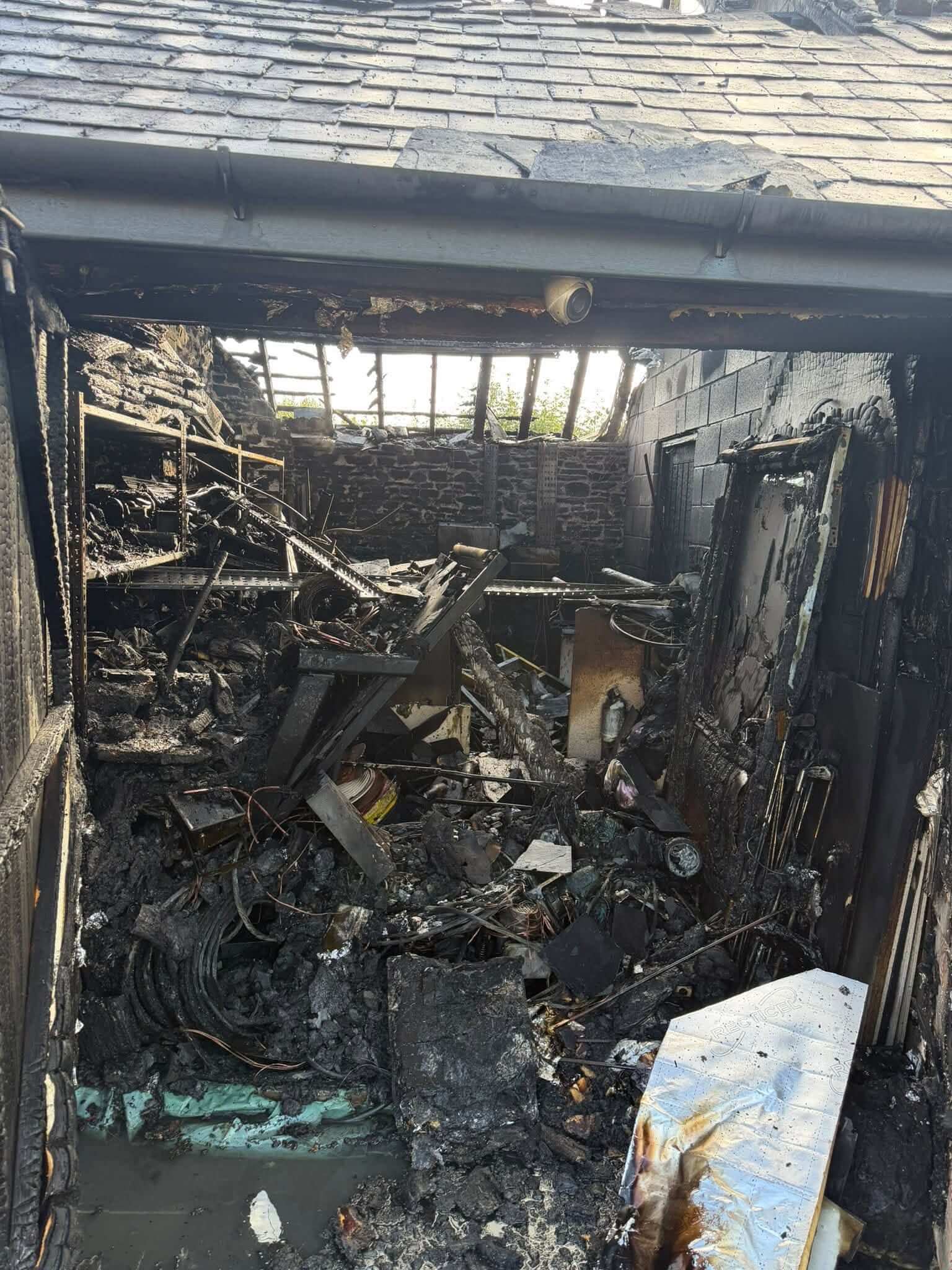 Burnt-out utility area with the roof open to the sky