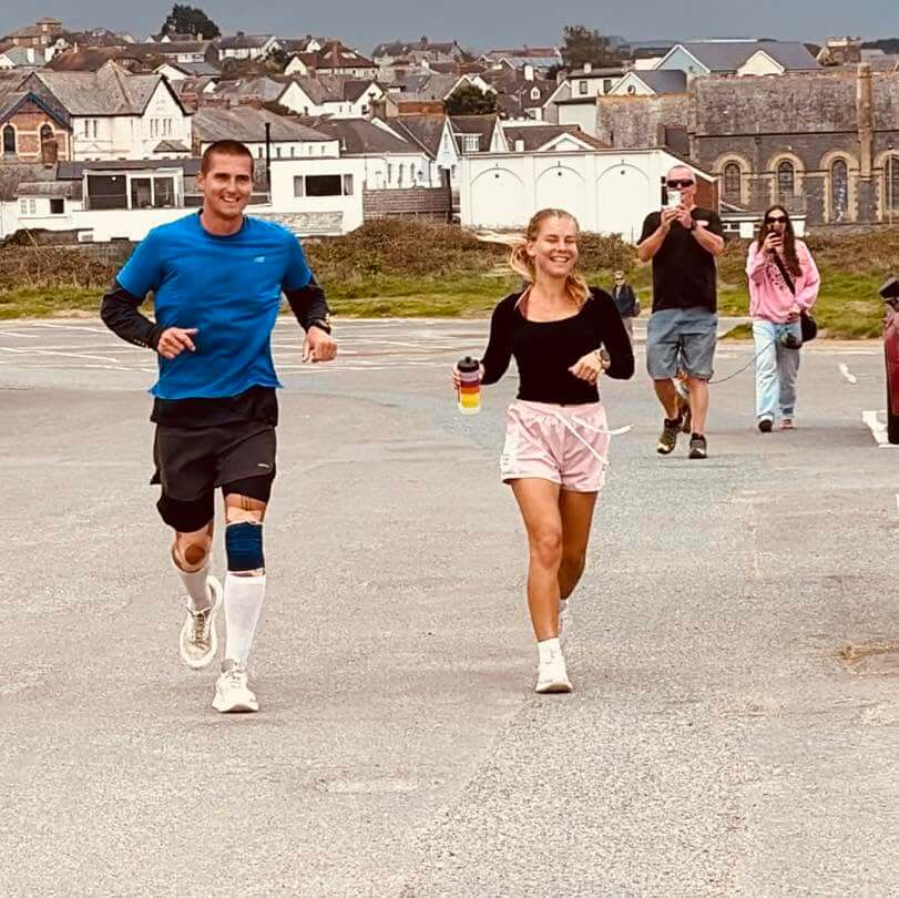 Two runners side by side during a lap in Bude