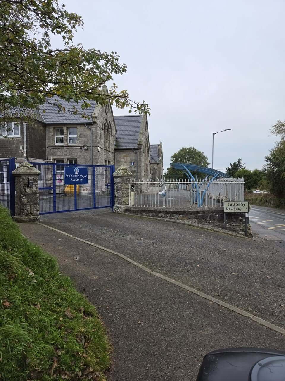 The gates of St Columb Major Academy beside the A3059