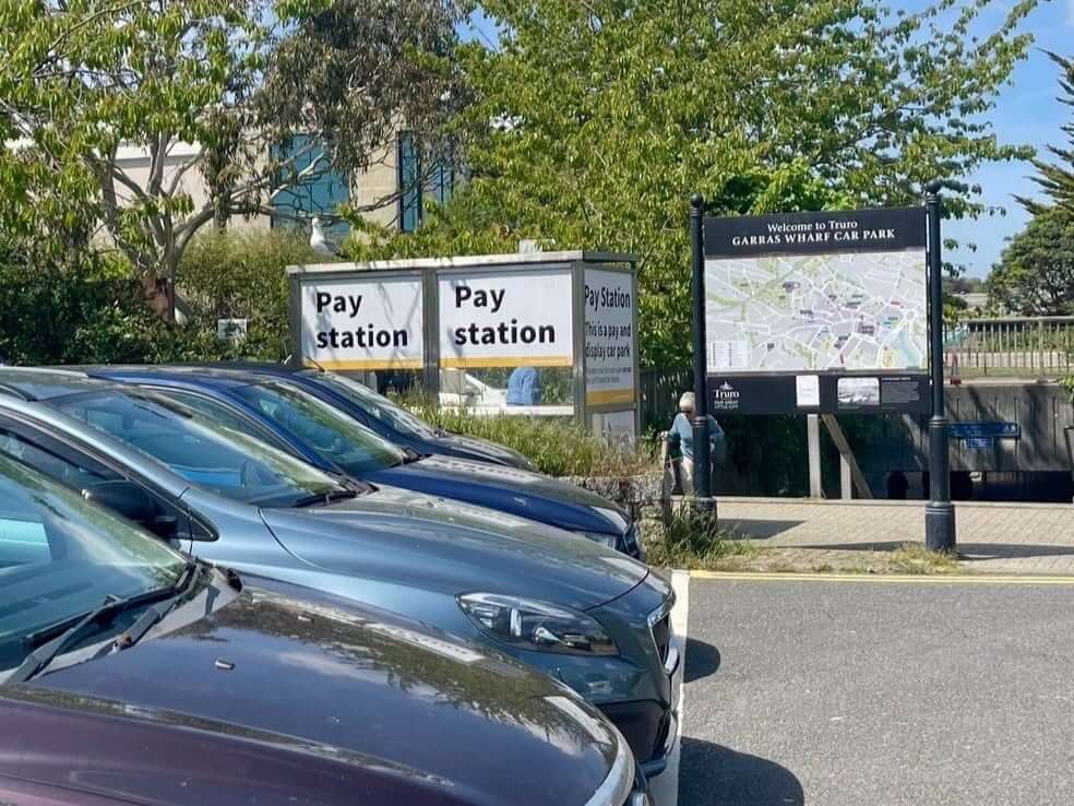 Pay stations and welcome sign at Garras Wharf Car Park in Truro