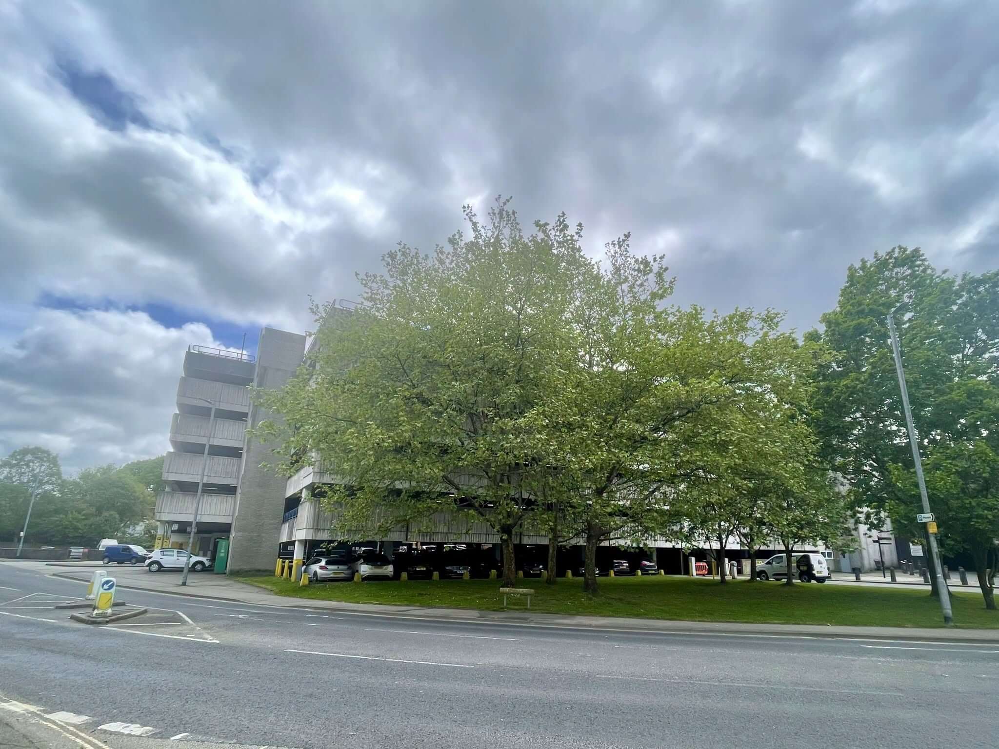 Multi-storey car park in Truro behind trees