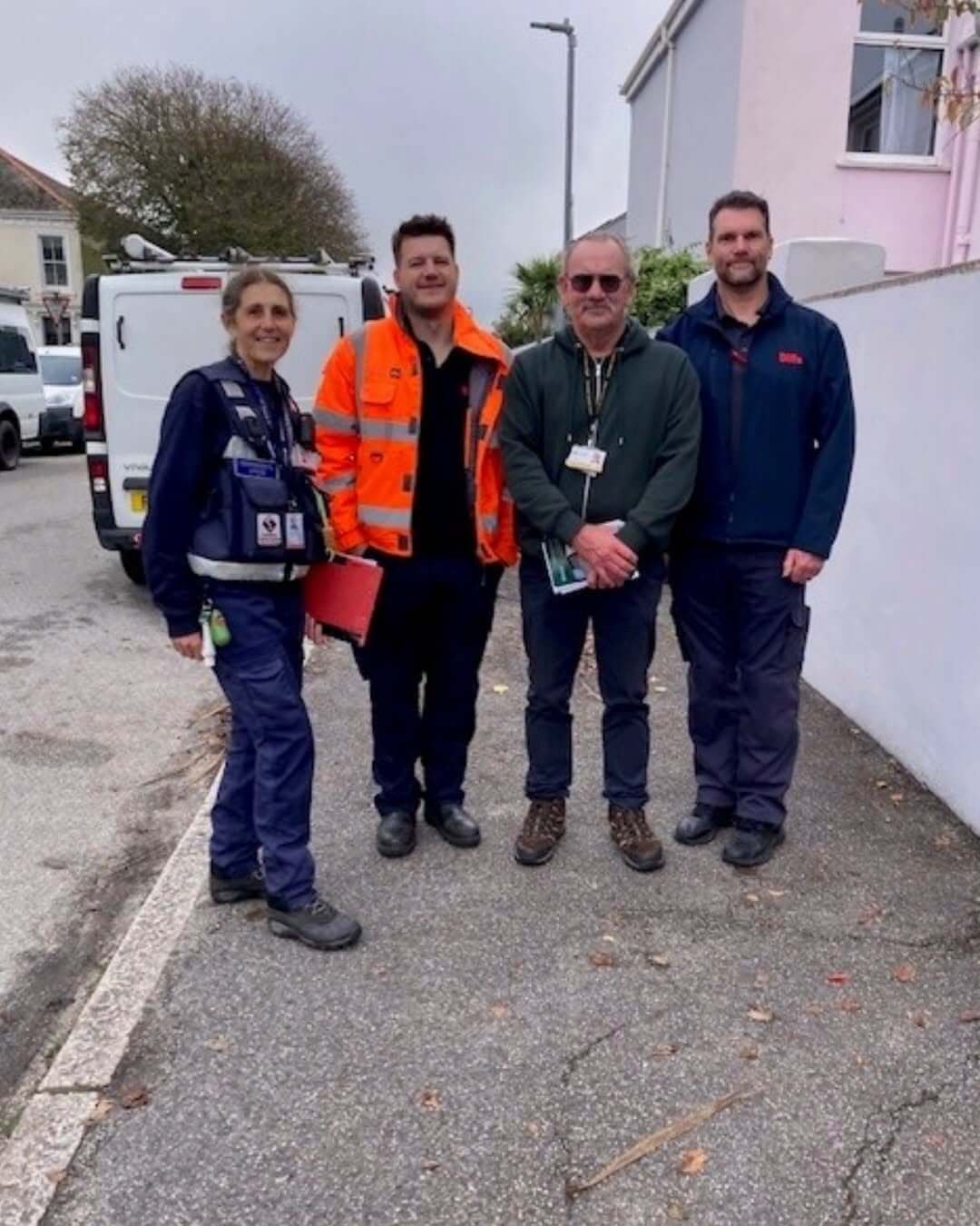 Four members of the Student Hello Visits team standing on a Falmouth pavement
