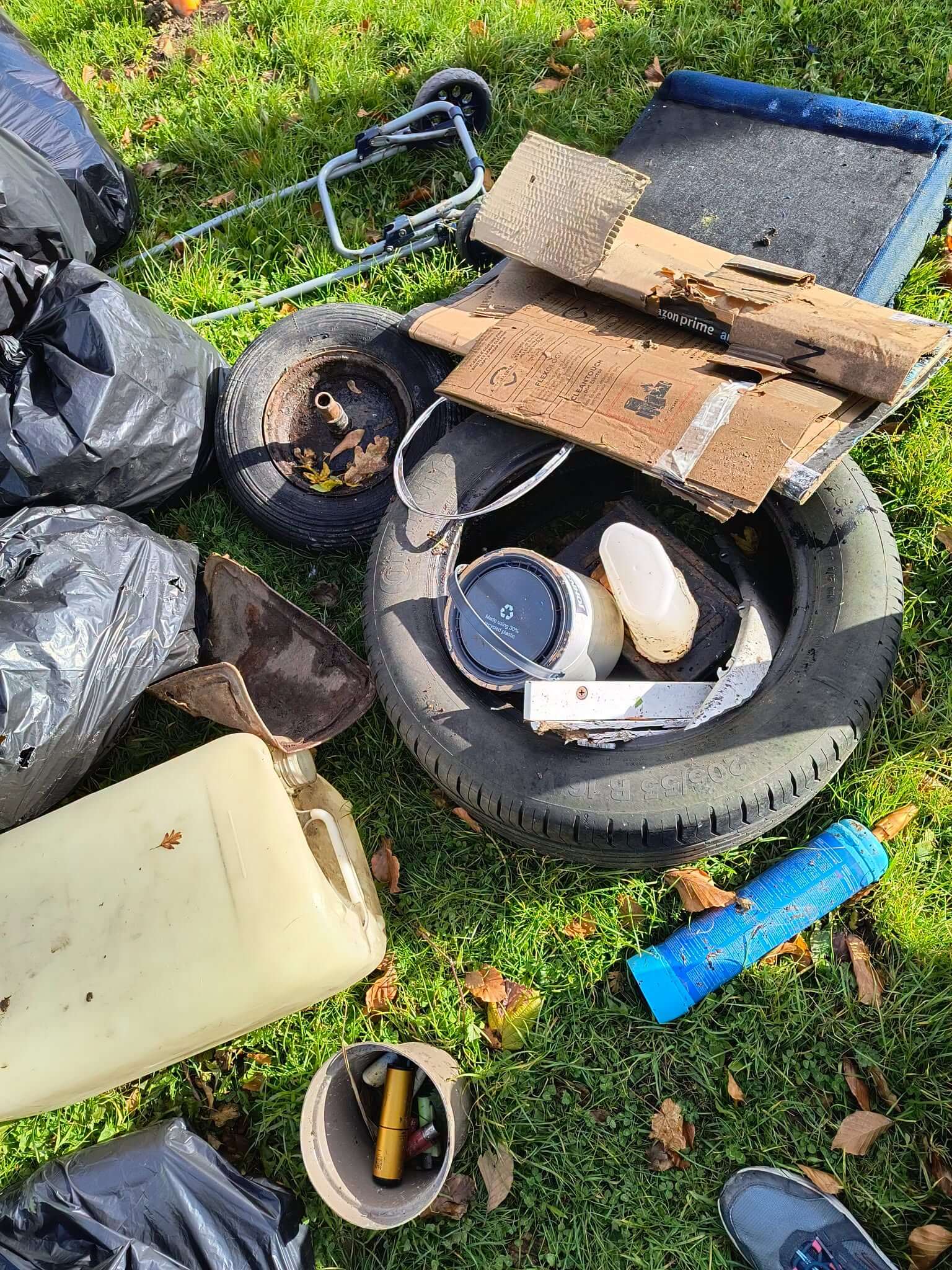 Tyres, a trolley, cardboard, a paint pot, a plastic container, a gas canister and vapes collected in Bodmin