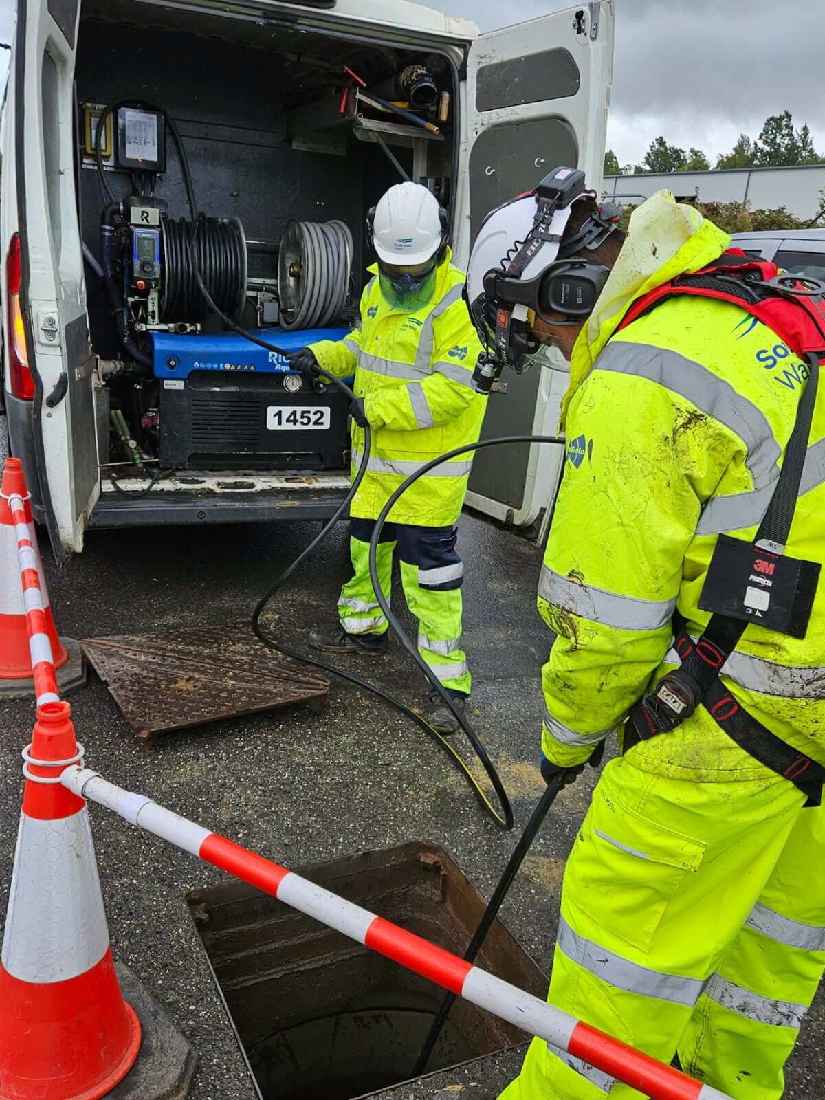 South West Water crew clearing a sewer blockage through an open manhole