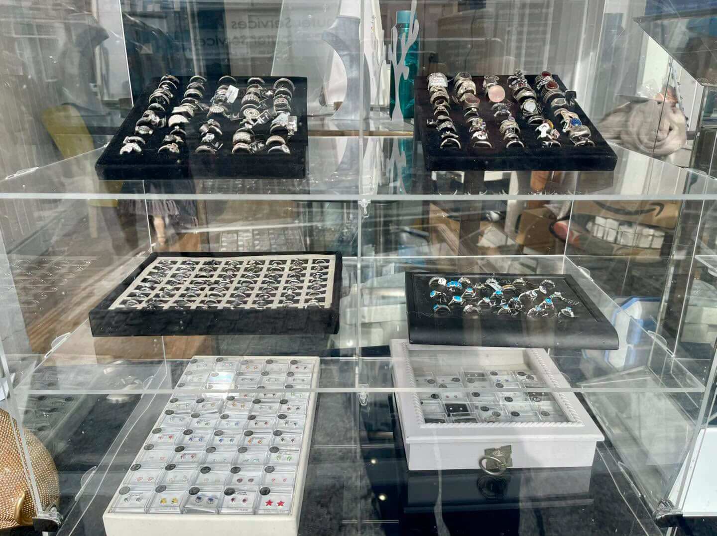 Trays of silver rings and earrings on display at Bailey's