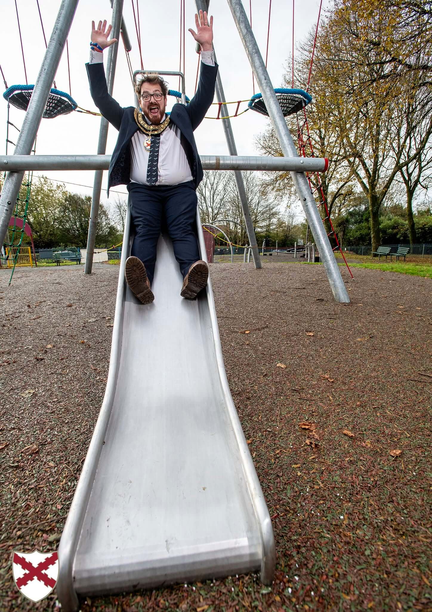 St Austell Mayor Ethan Stephens coming down the slide on the Bird's Nest Tower