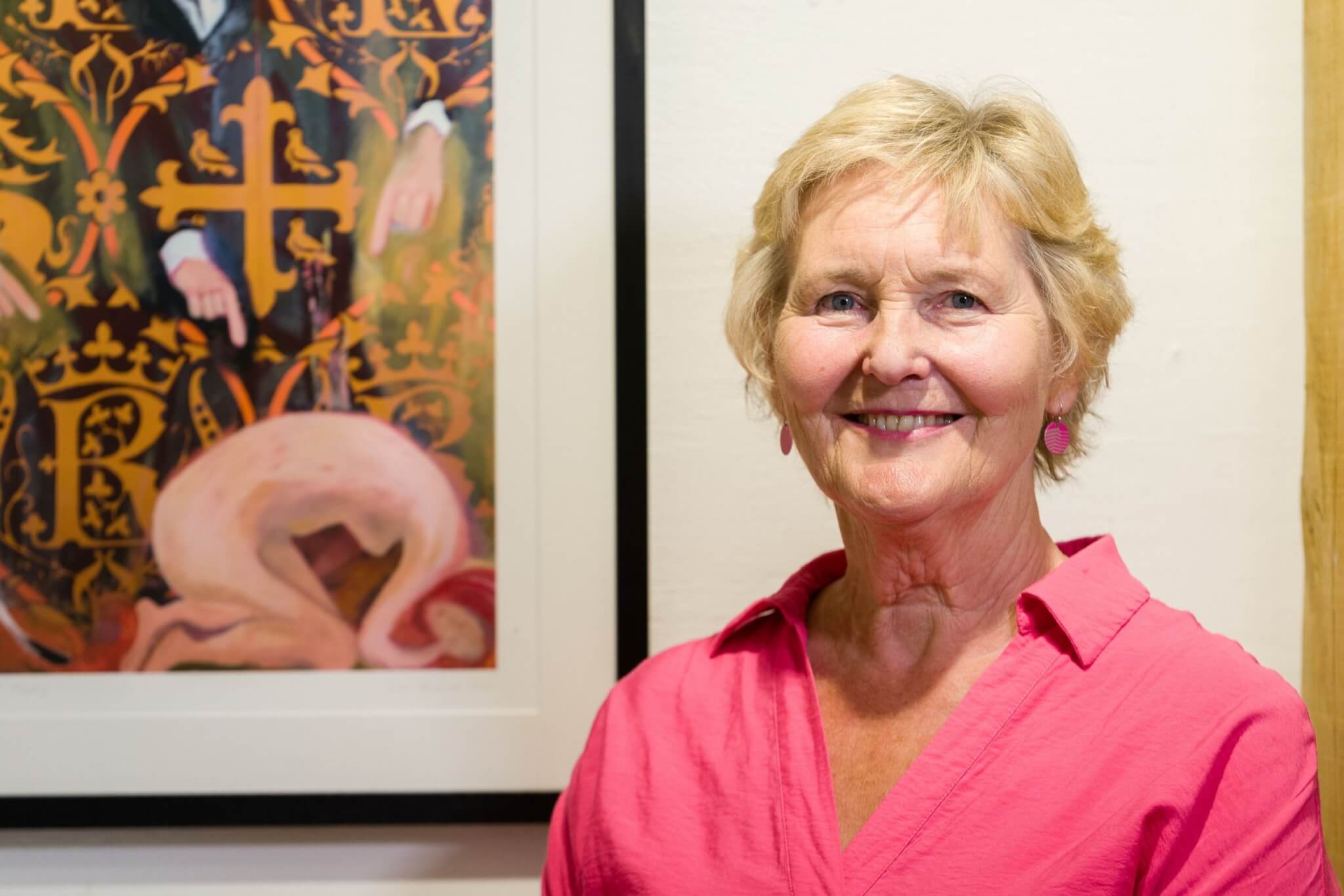 Artist Terrye Teverson beside one of her works