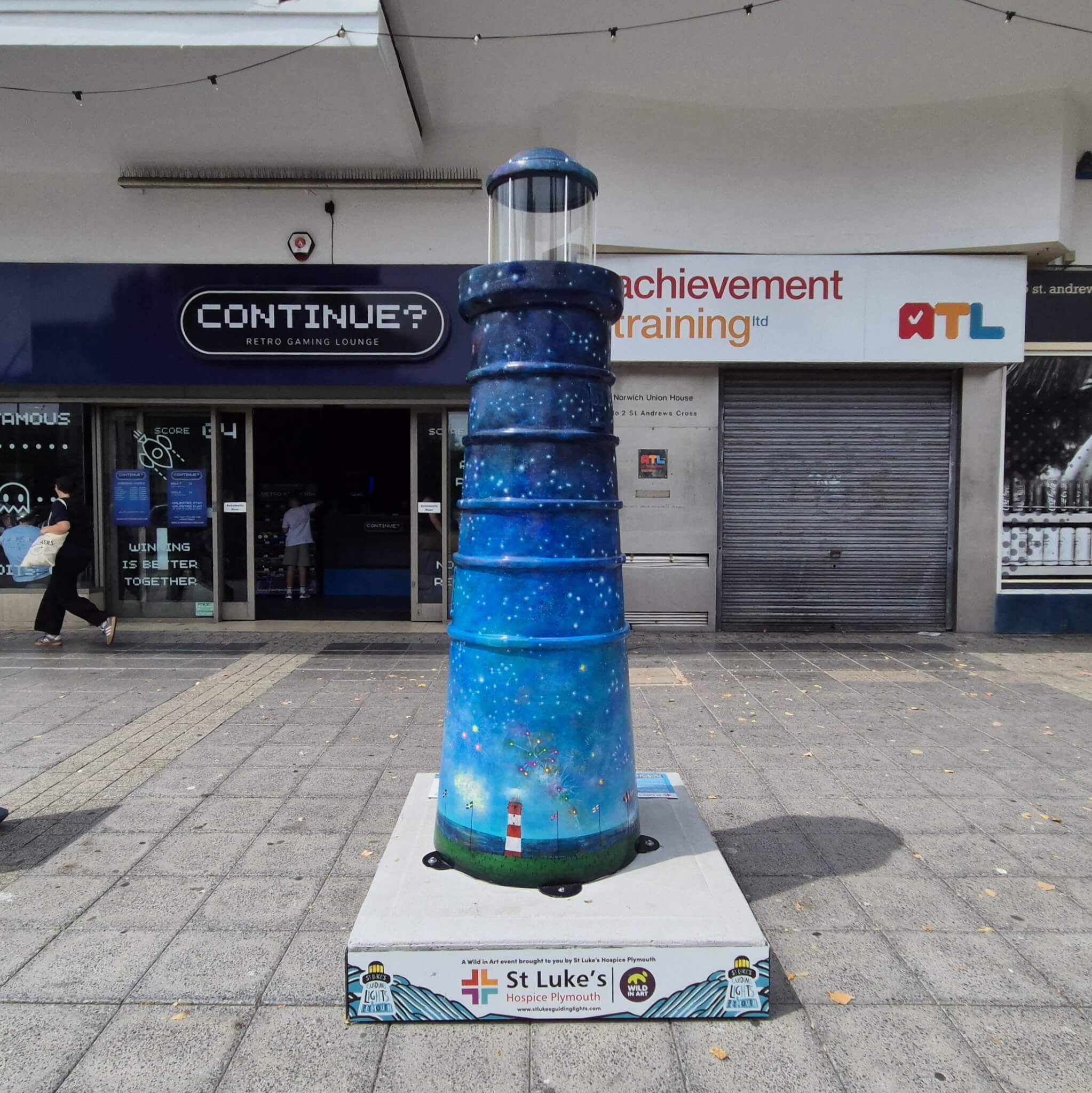 Celestial Beacon lighthouse sculpture painted as a starry night sky, on display in Plymouth