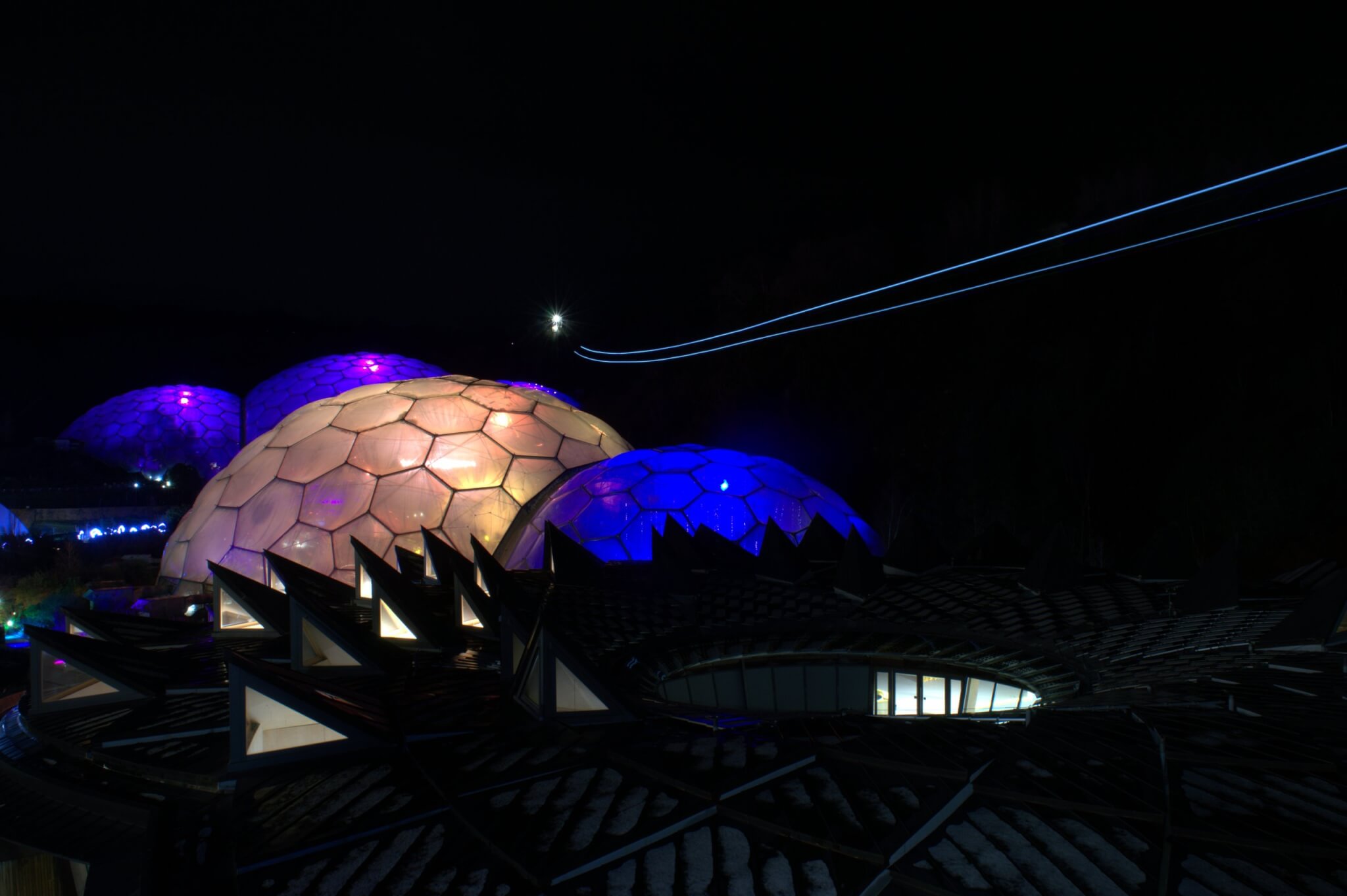Hangloose Adventure Skywire Night Flight light trail above the illuminated Eden Project biomes