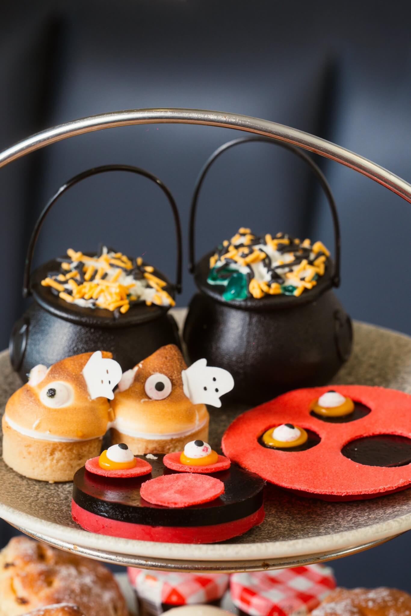 Children's Halloween cakes on an afternoon tea stand