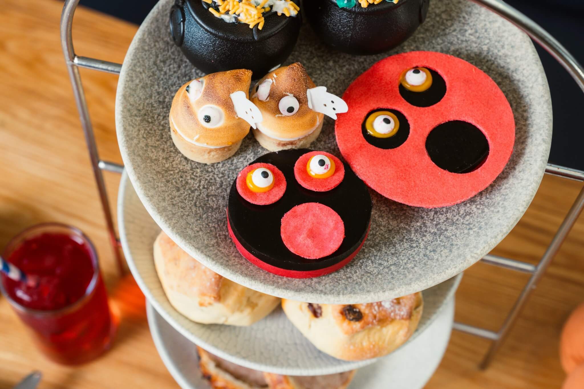 Children's Halloween afternoon tea top tier with cauldrons and ghoul treats