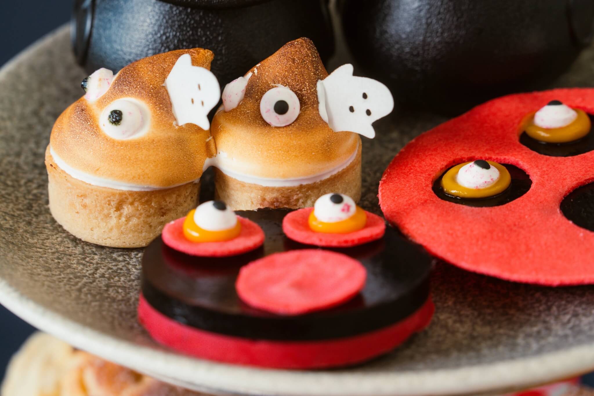 Spooky lemon meringue tarts and monster-face treats on the children's afternoon tea