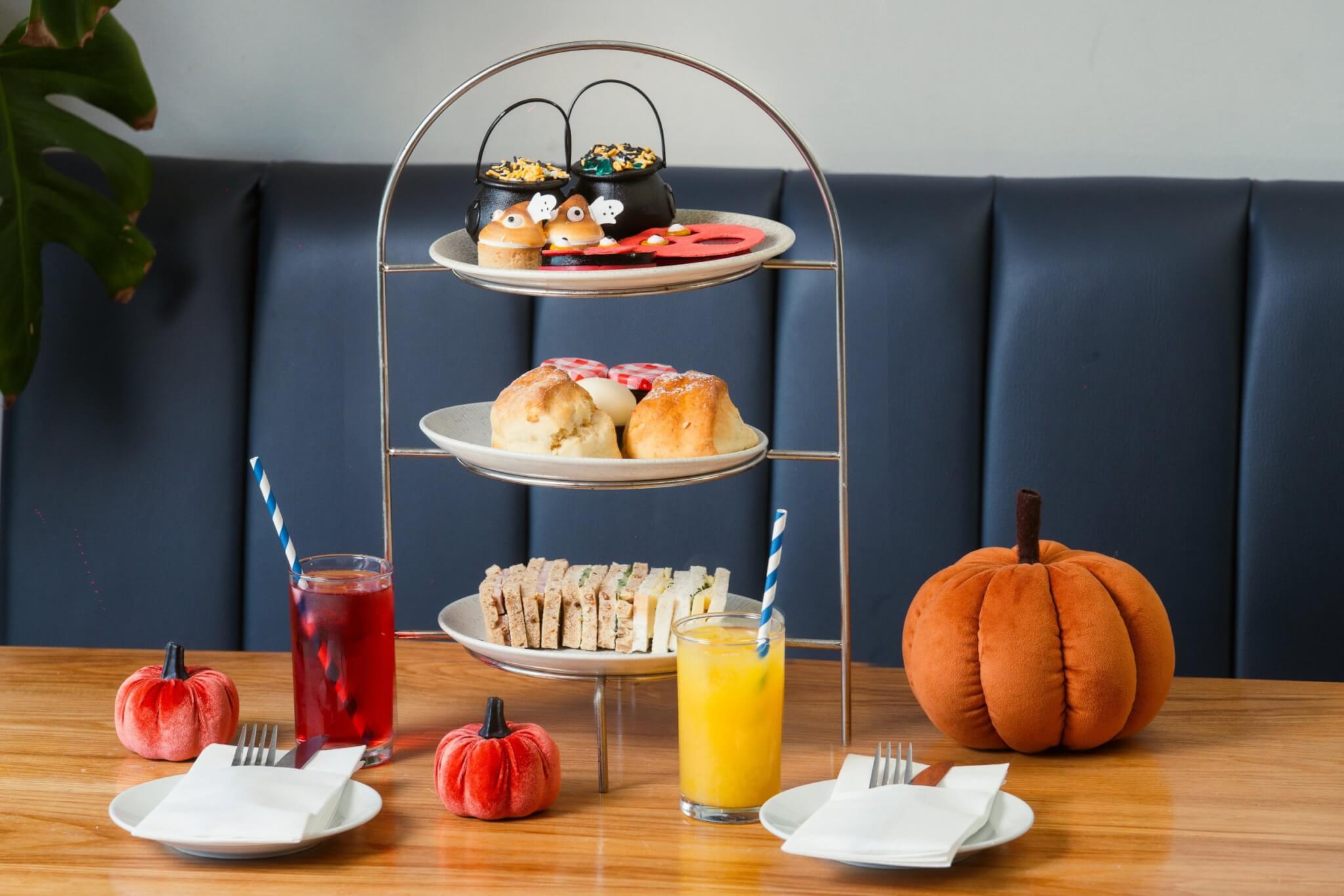 Children's Halloween afternoon tea stand with juice and pumpkins at The Esplanade, Newquay