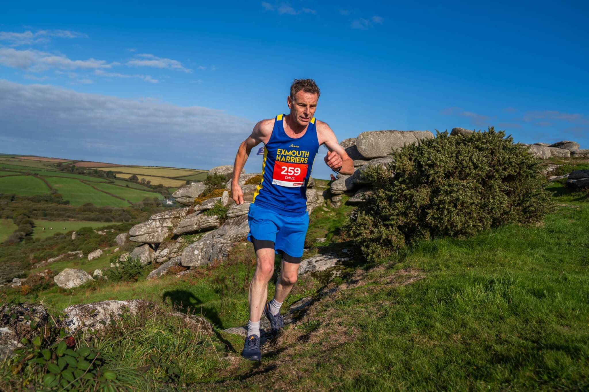Runner on a moorland trail section of the Eden Project Marathon