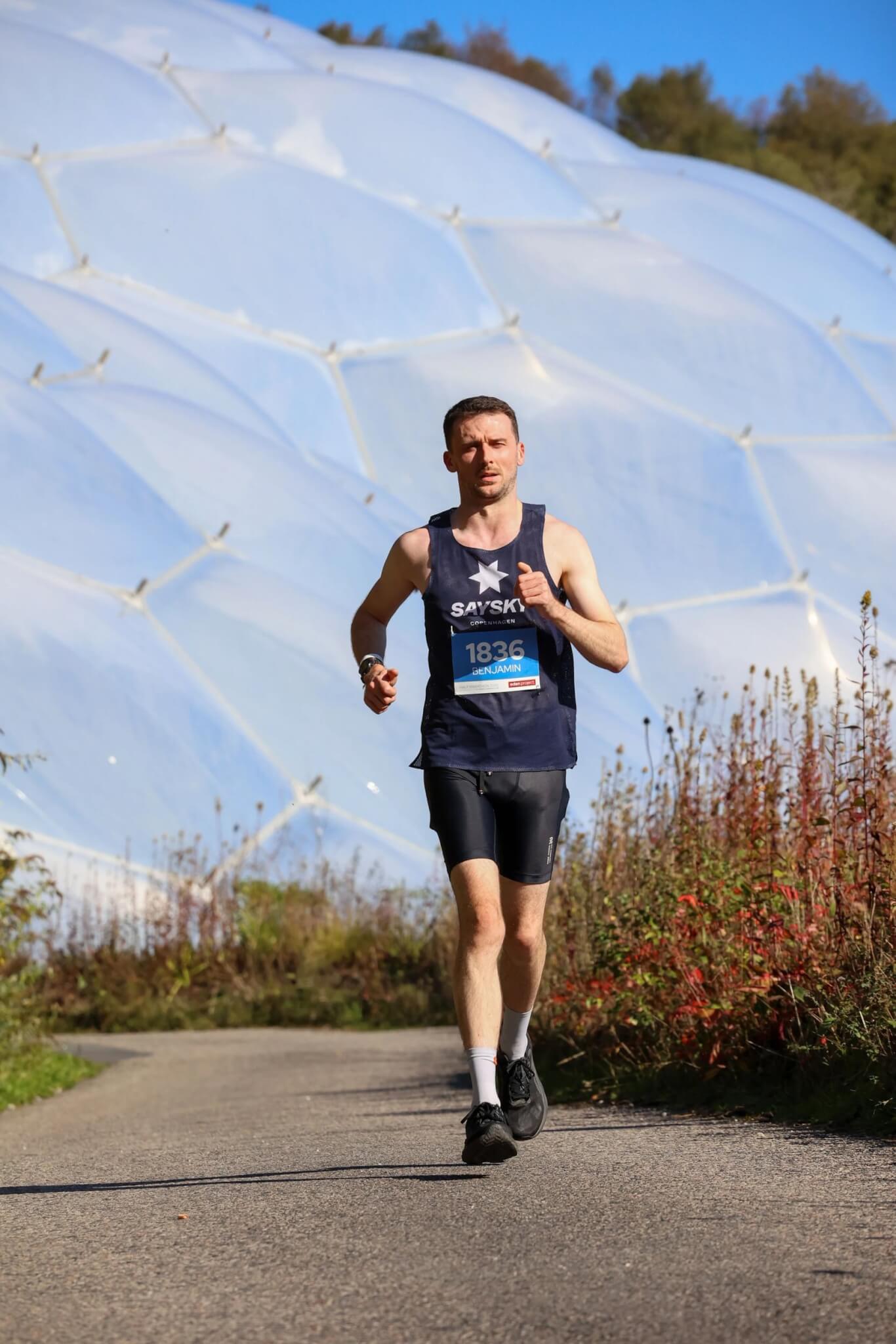 Runner on the path below the Eden Project Biomes