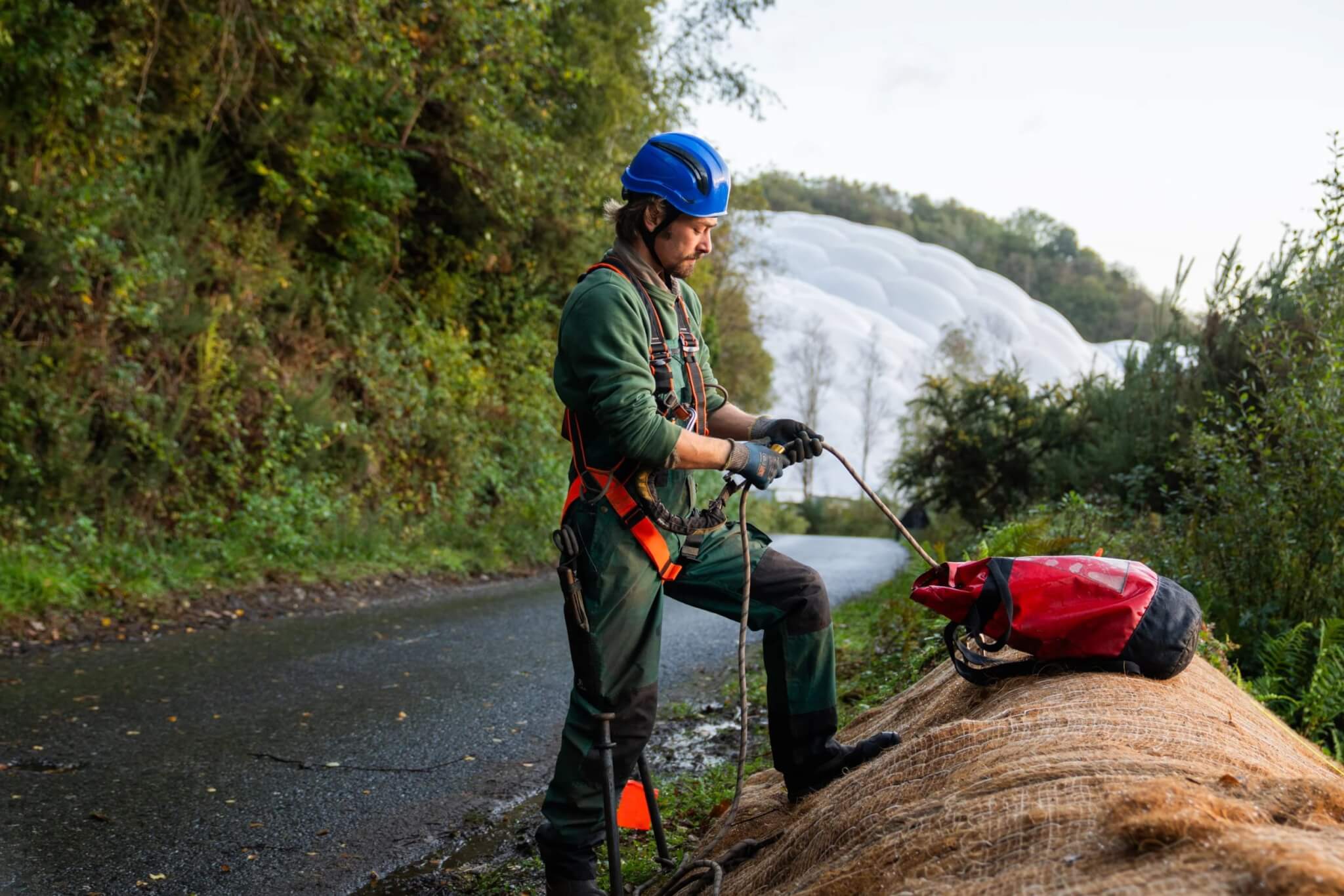 Eden Project gardener preparing ropes at the top of the slope