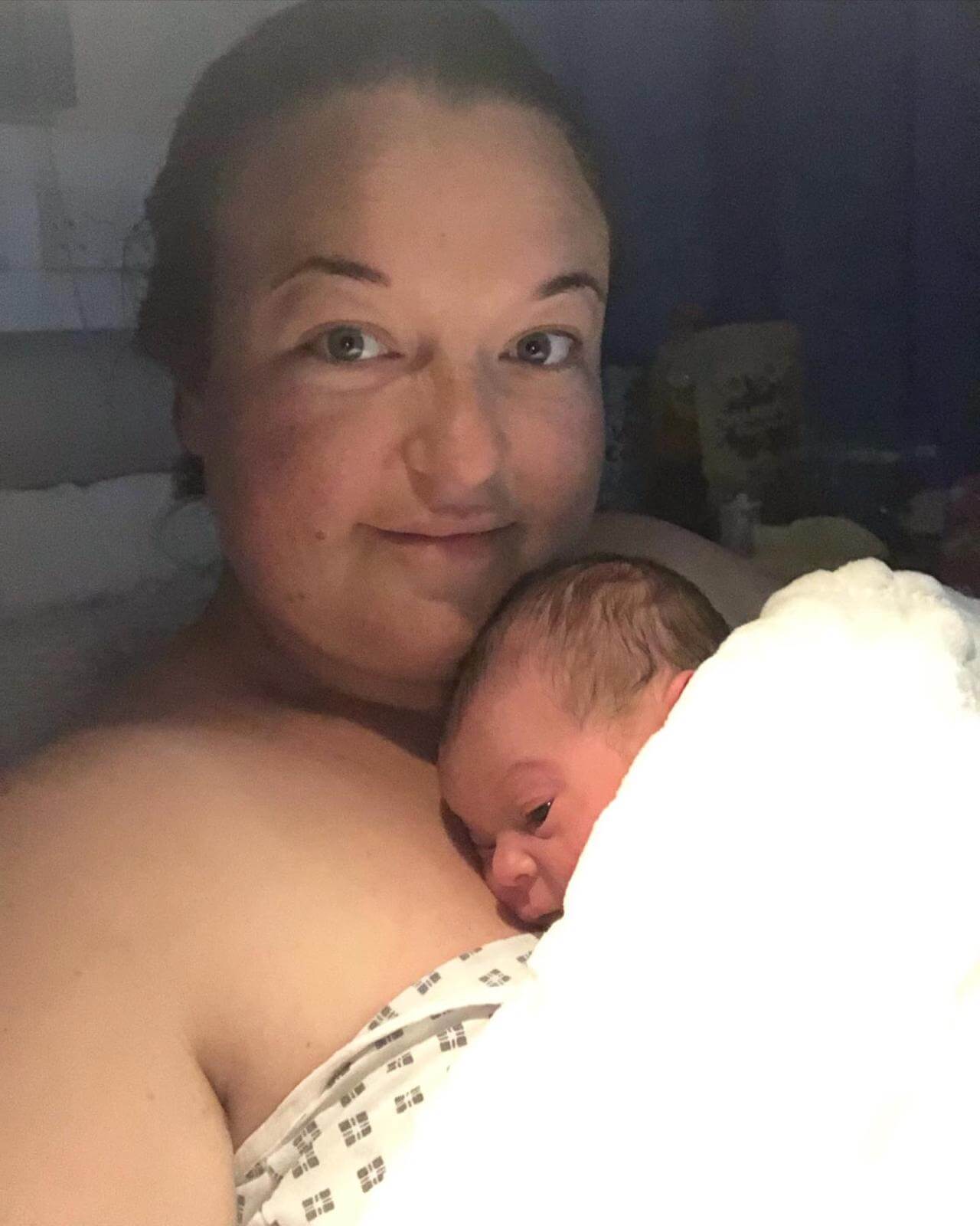 Sarah Doolin holding newborn Ezrah in hospital