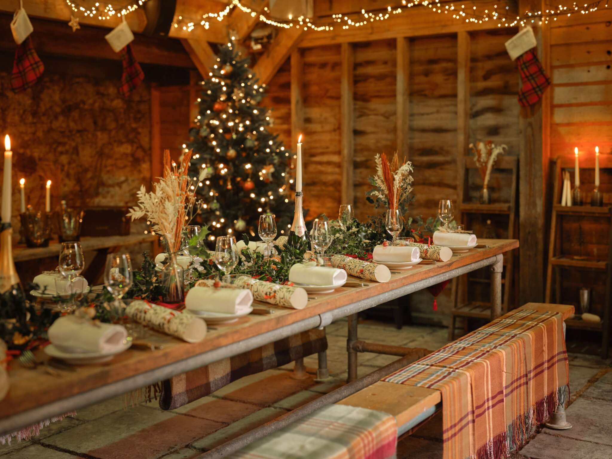 Festive long tables under fairy lights at The Tartan Fox