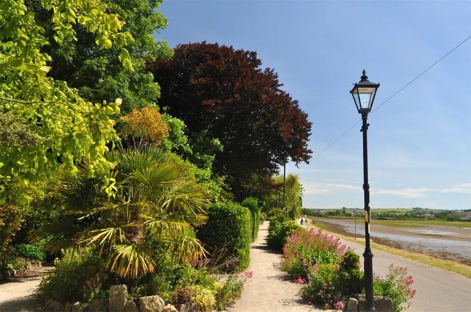 Path and lamp post along Copperhouse Pool on the Hayle and The Towans walk