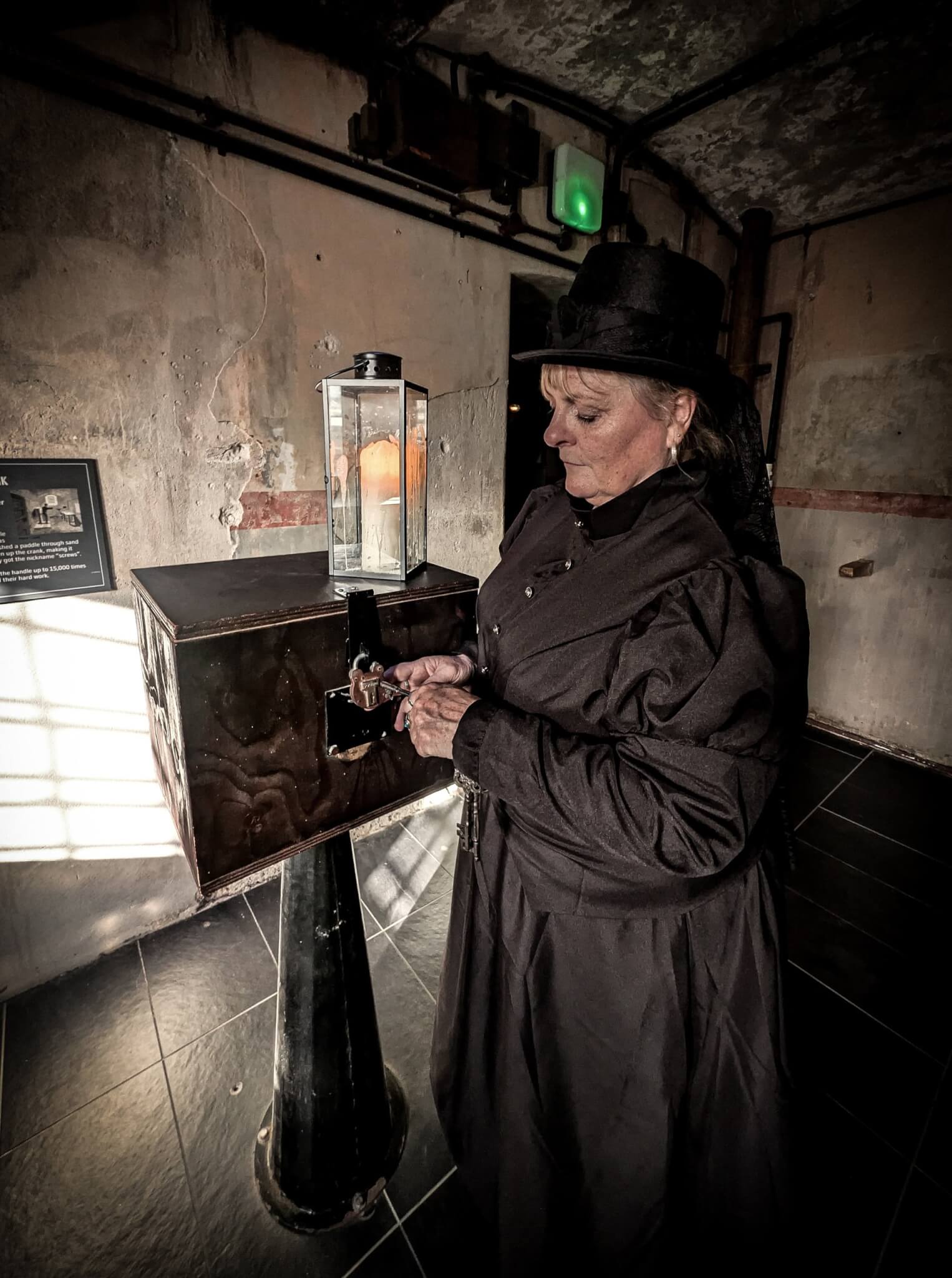 Ghost Walk guide in a corridor at Bodmin Jail
