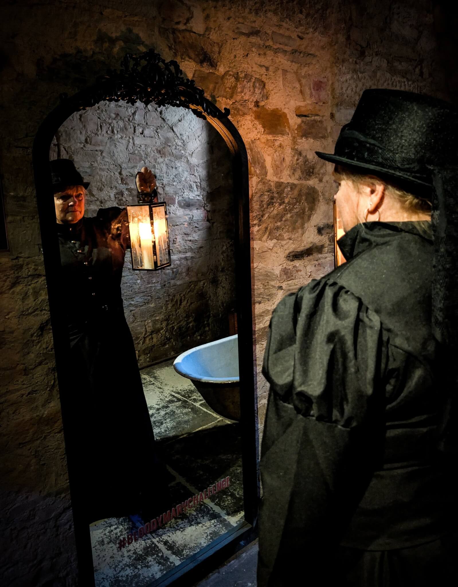 Ghost Walk guide in a lantern-lit cell at Bodmin Jail