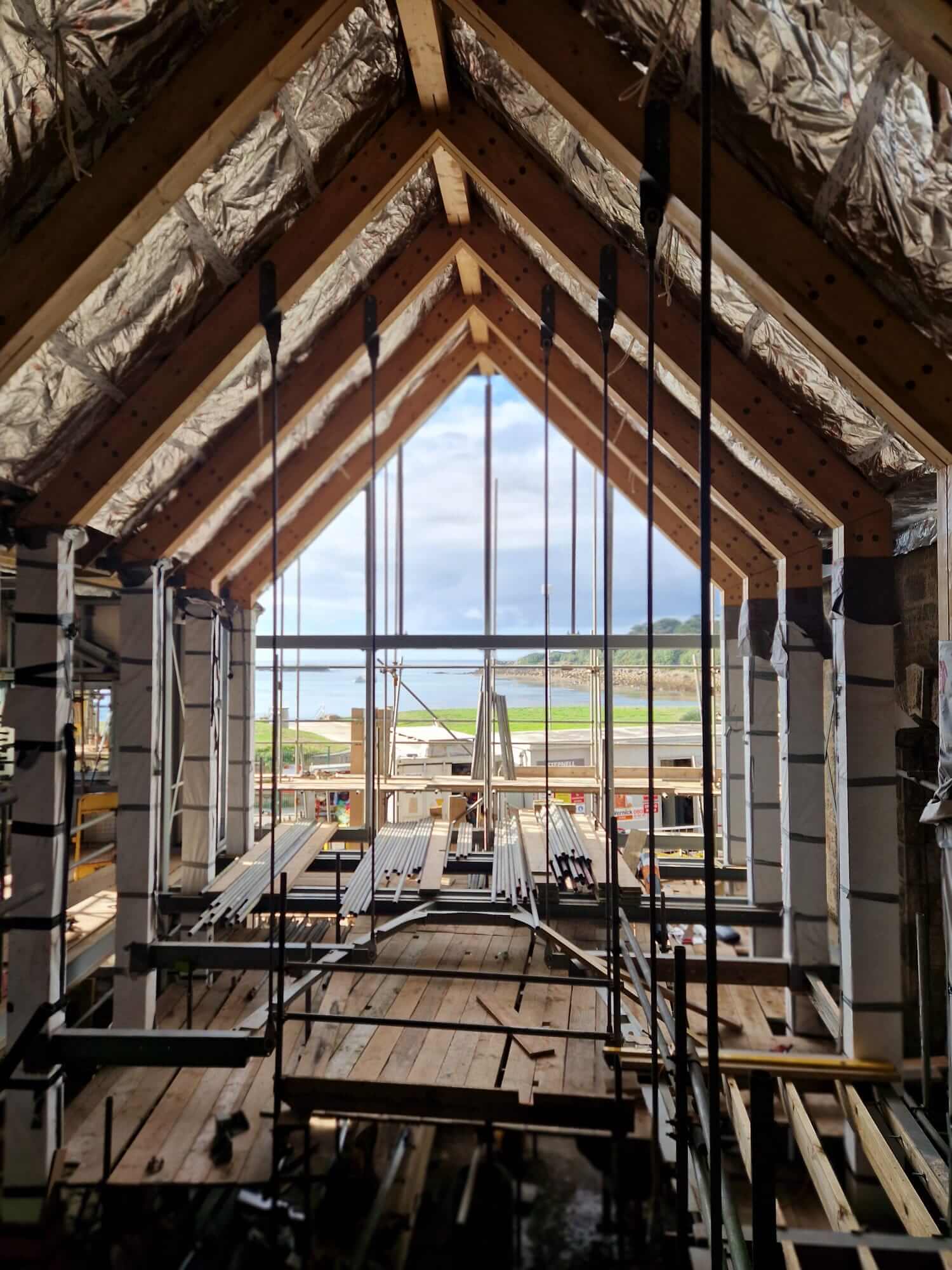 Exposed roof timbers inside the Town Hall on St Mary's looking out to sea