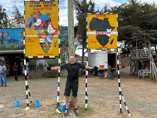 Jason Schofield at the Equator signs in Kenya