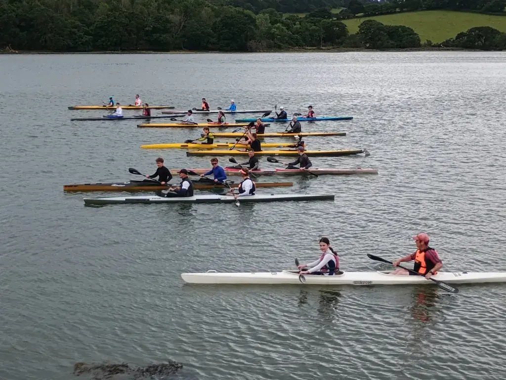 Double kayaks during a training session on the River Fal