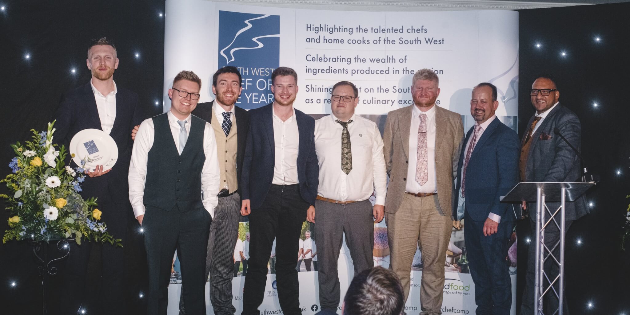 L-R Rory Larkin from Lactalis Professional, Samuel Loader, Will Bradridge, Harrison Holmes, Tom Bennetts, Jordan Bartholemew, Seth Ward from Bidfood and Michael Caines