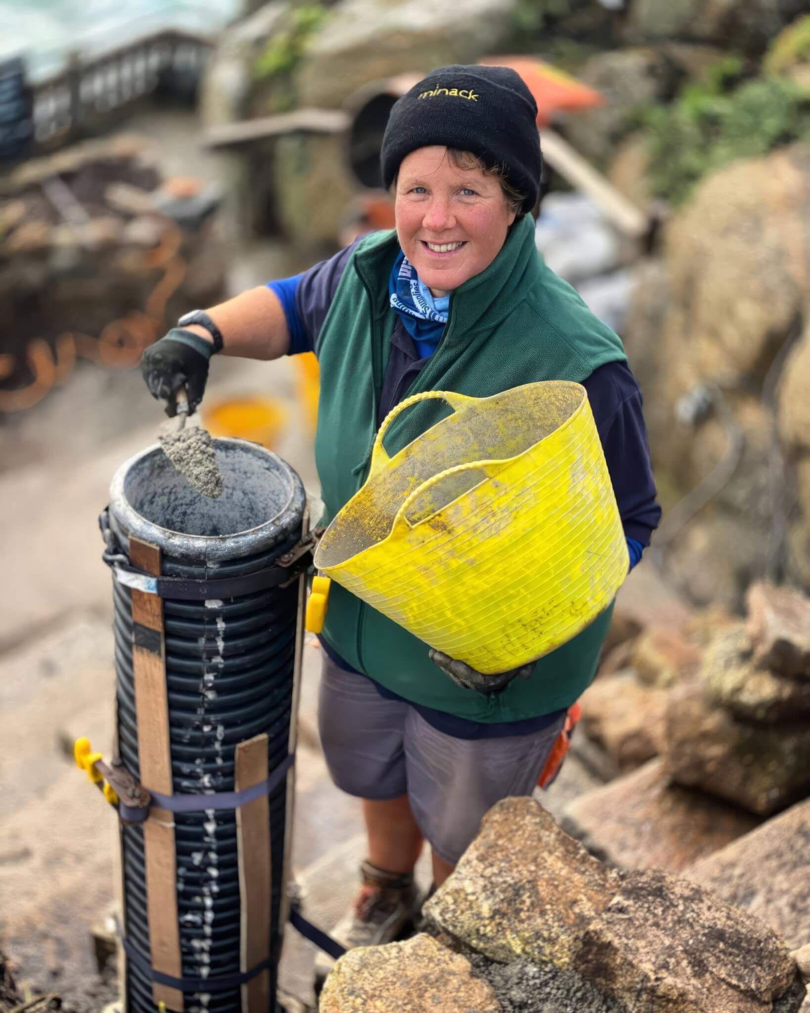 Lynn Batten filling a pillar mould with concrete at the Minack Theatre