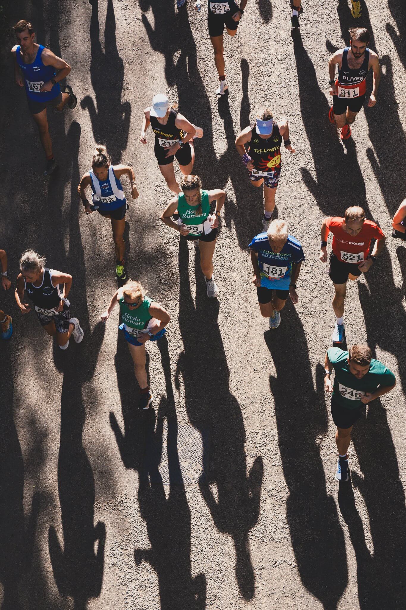 Overhead view of runners on the downhill start of the Marazion 10K