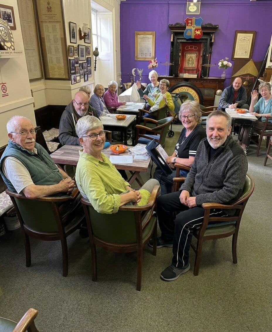 Oddfellows members seated at tables in Redruth's Oddfellows Hall
