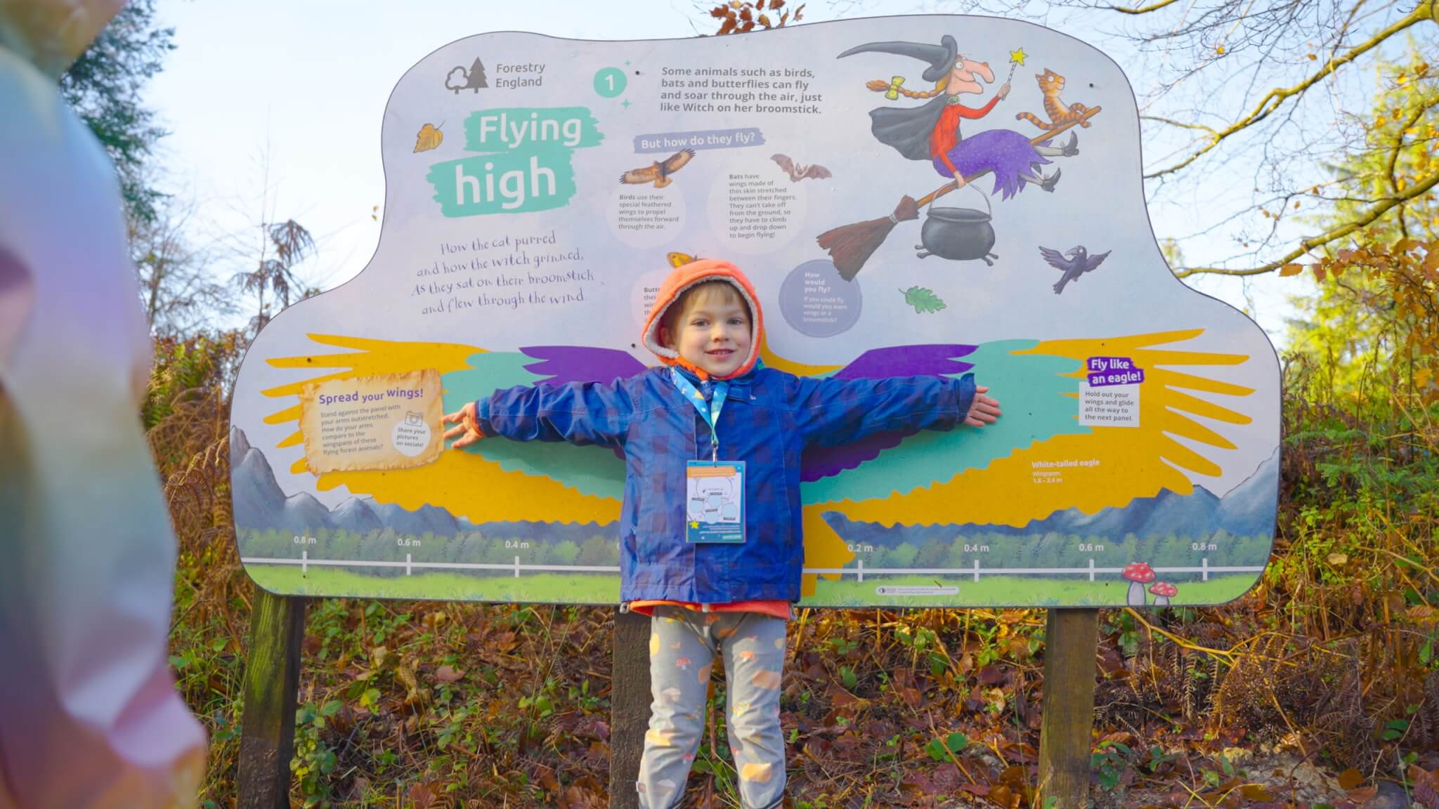A child at a Room on the Broom trail panel