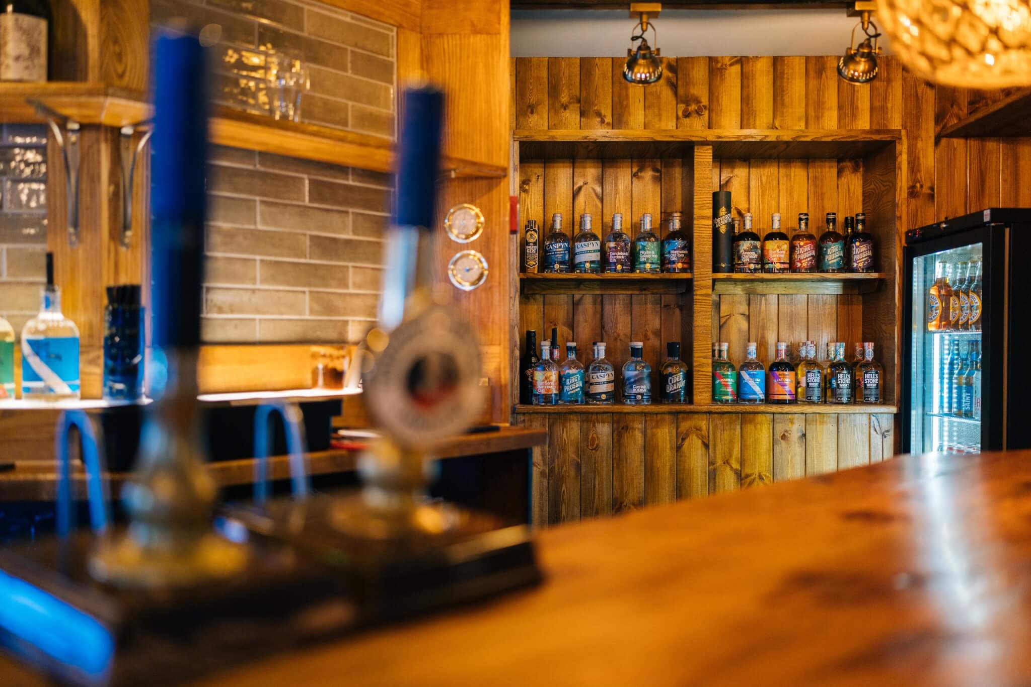Refreshed bar at the Red Lion in Newlyn with Cornish spirits on the shelves