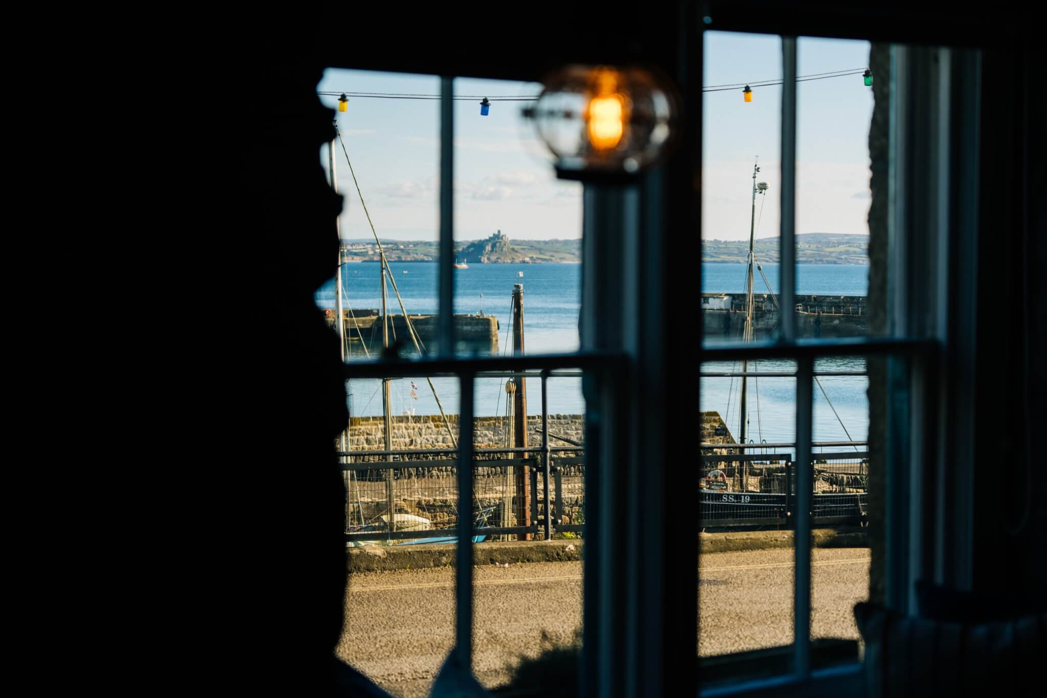 Sea view through a window at the Red Lion in Newlyn