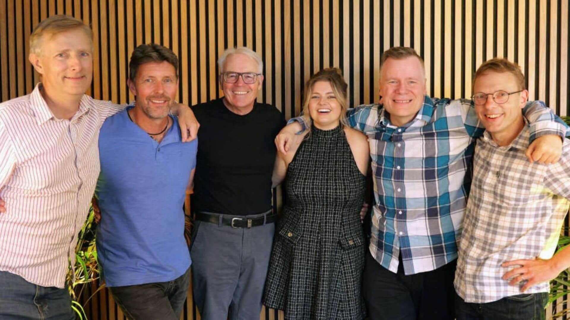 Six Rewind Radio Retro presenters standing together