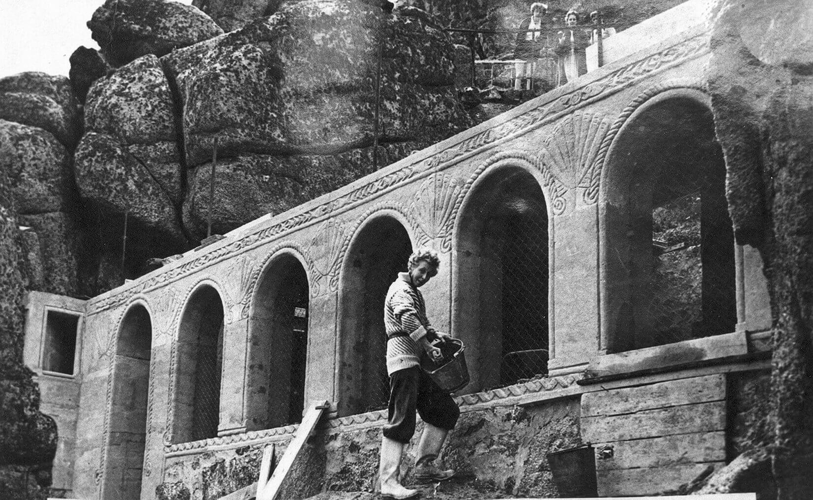 Rowena Cade at work beside the arches of the dressing rooms